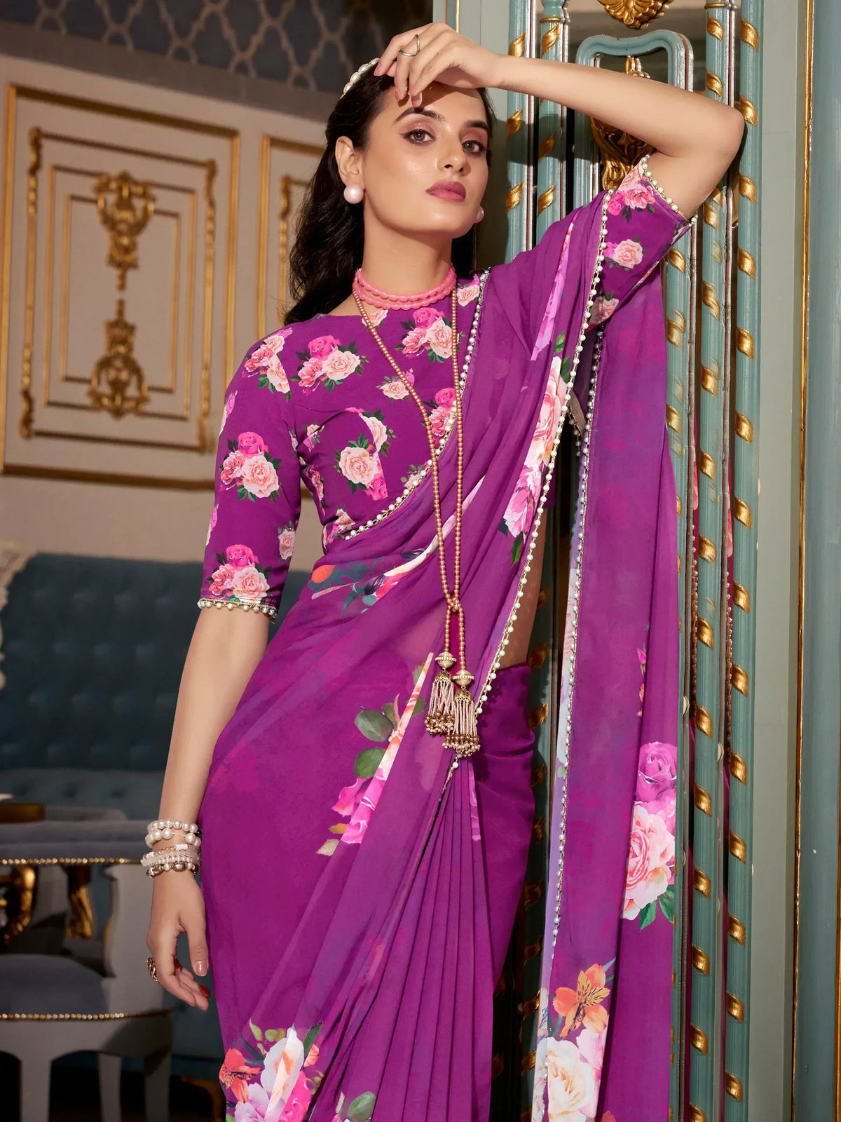 Purple floral saree with pearl embellishments, elegant Indian ethnic wear for women