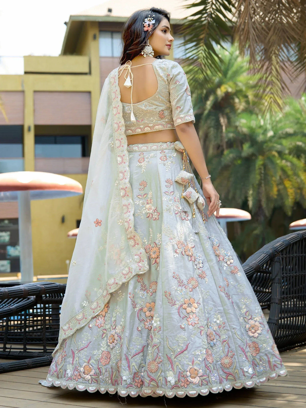 Elegant pastel lehenga choli with floral embroidery, perfect for weddings and festive occasions.