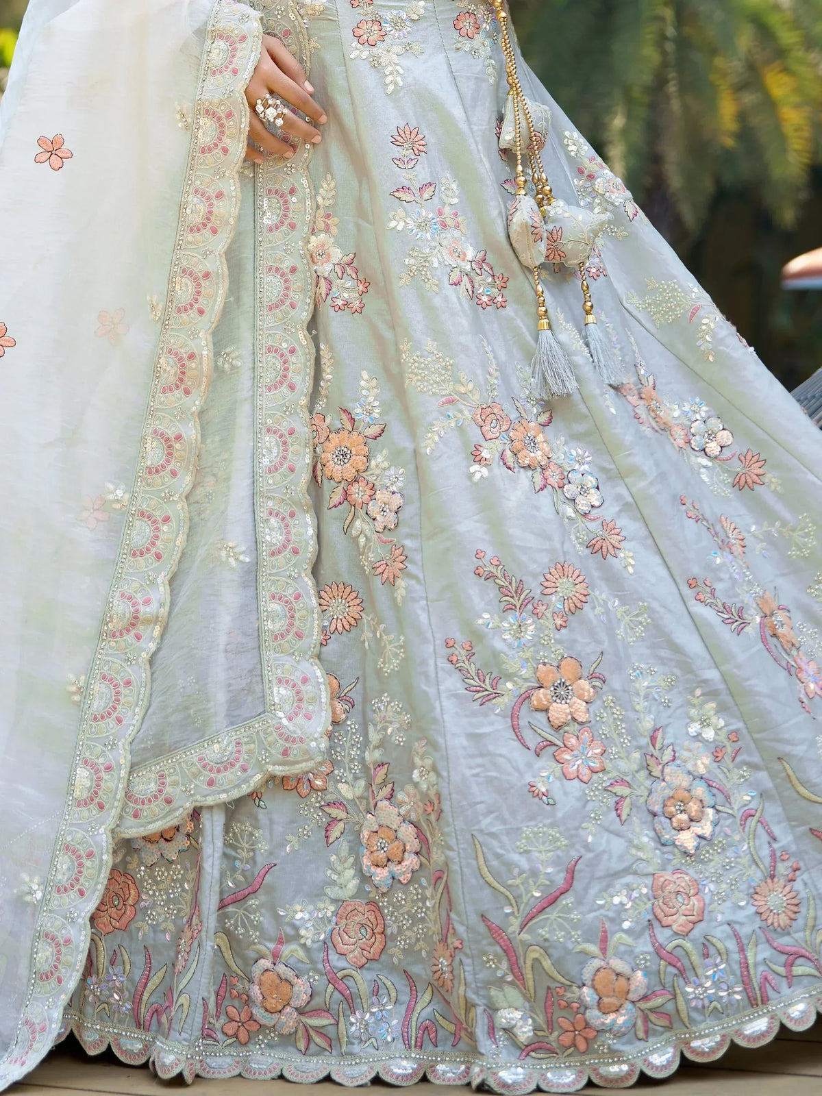 Mint green designer lehenga with floral embroidery, sequins, and scalloped dupatta for Indian ethnic wear