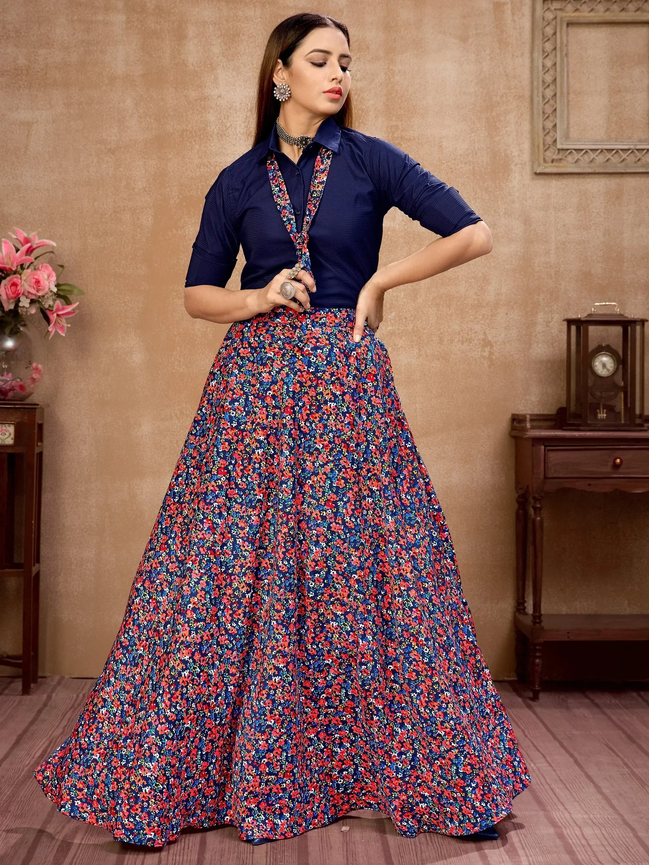Woman in navy blue floral print ethnic gown with matching top, perfect for Indian occasions