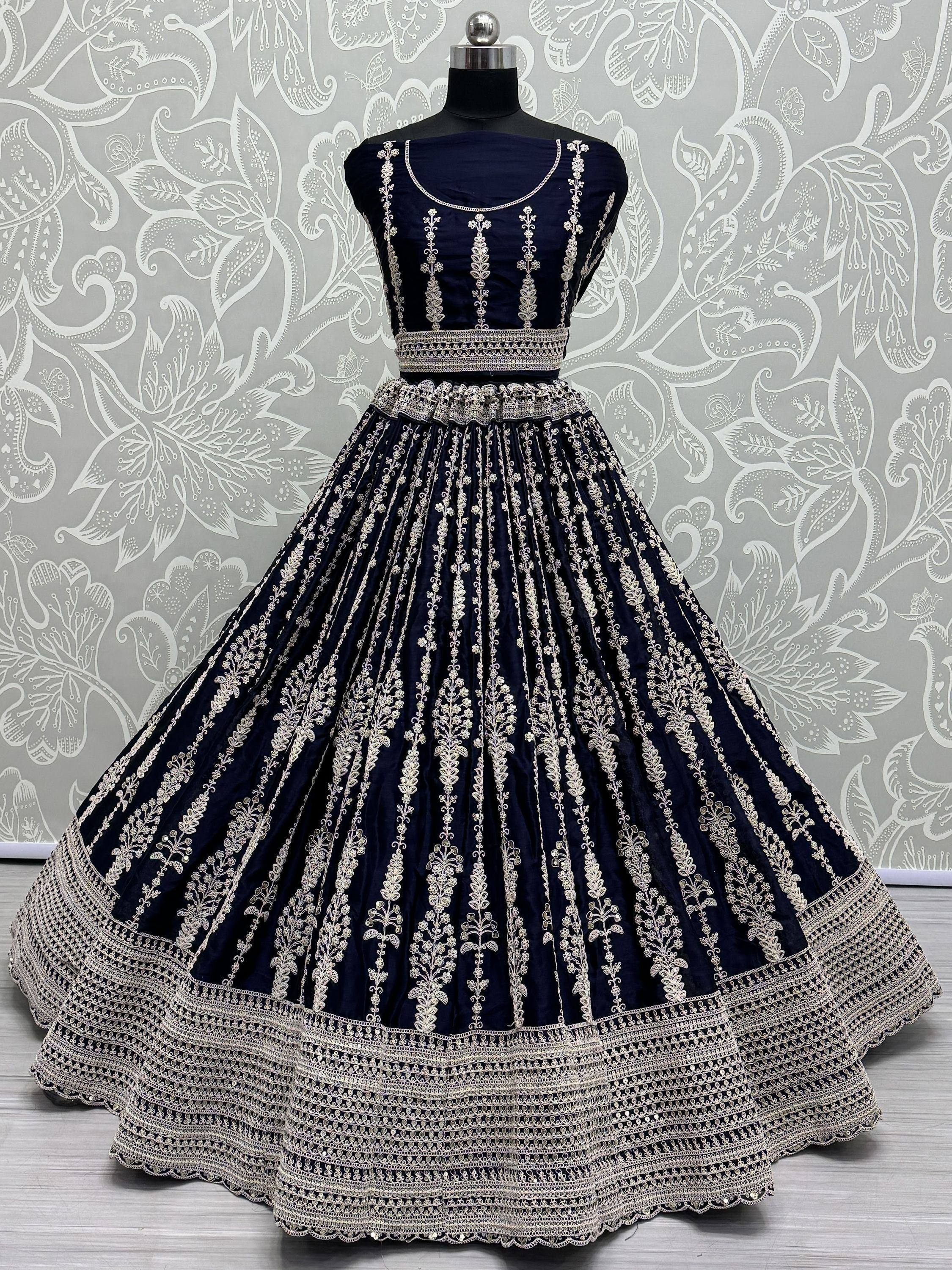 Navy blue embroidered lehenga choli with gold floral detailing, perfect for Indian ethnic wear events