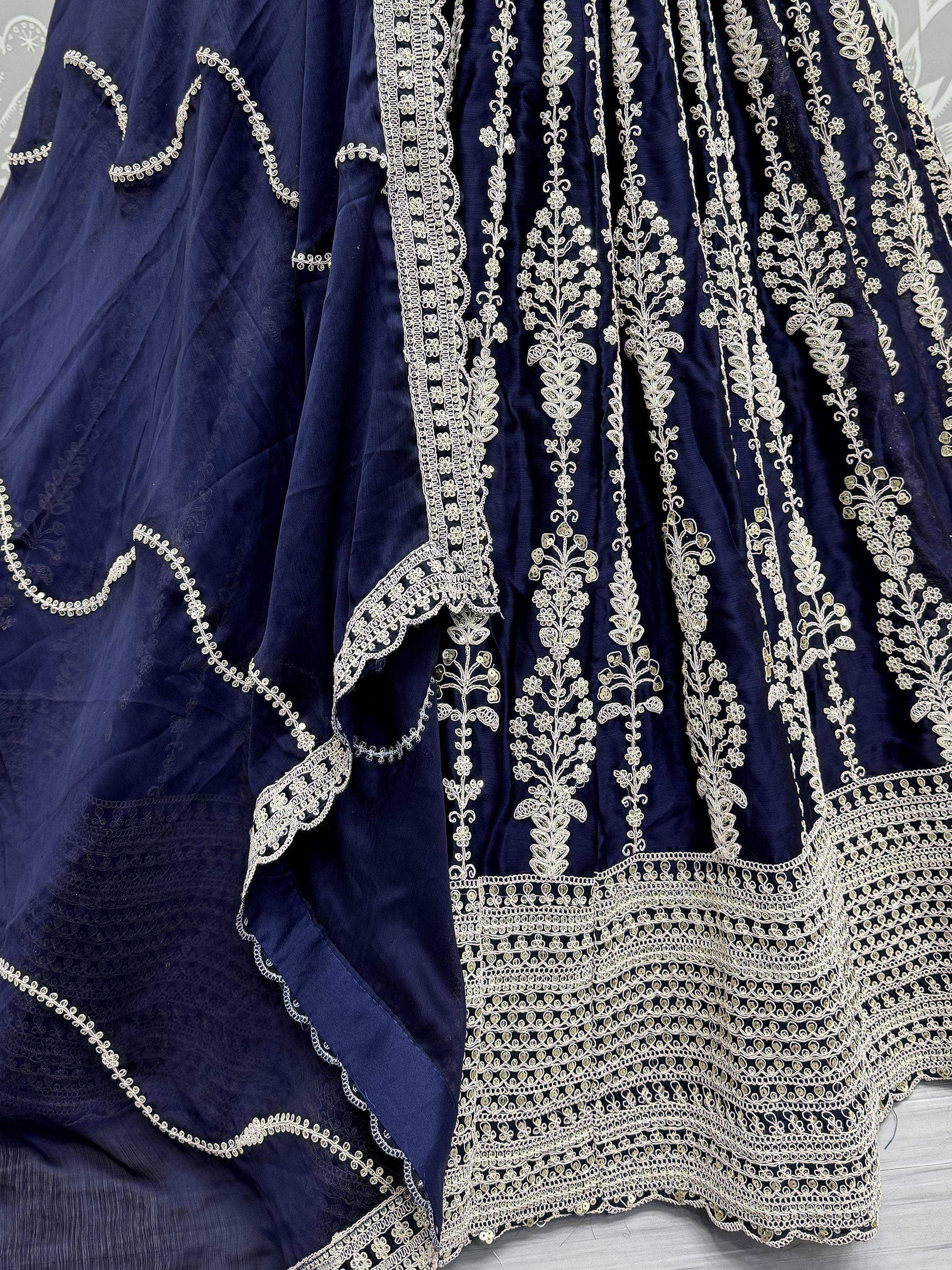 Navy blue lehenga with intricate gold floral embroidery and detailed border work