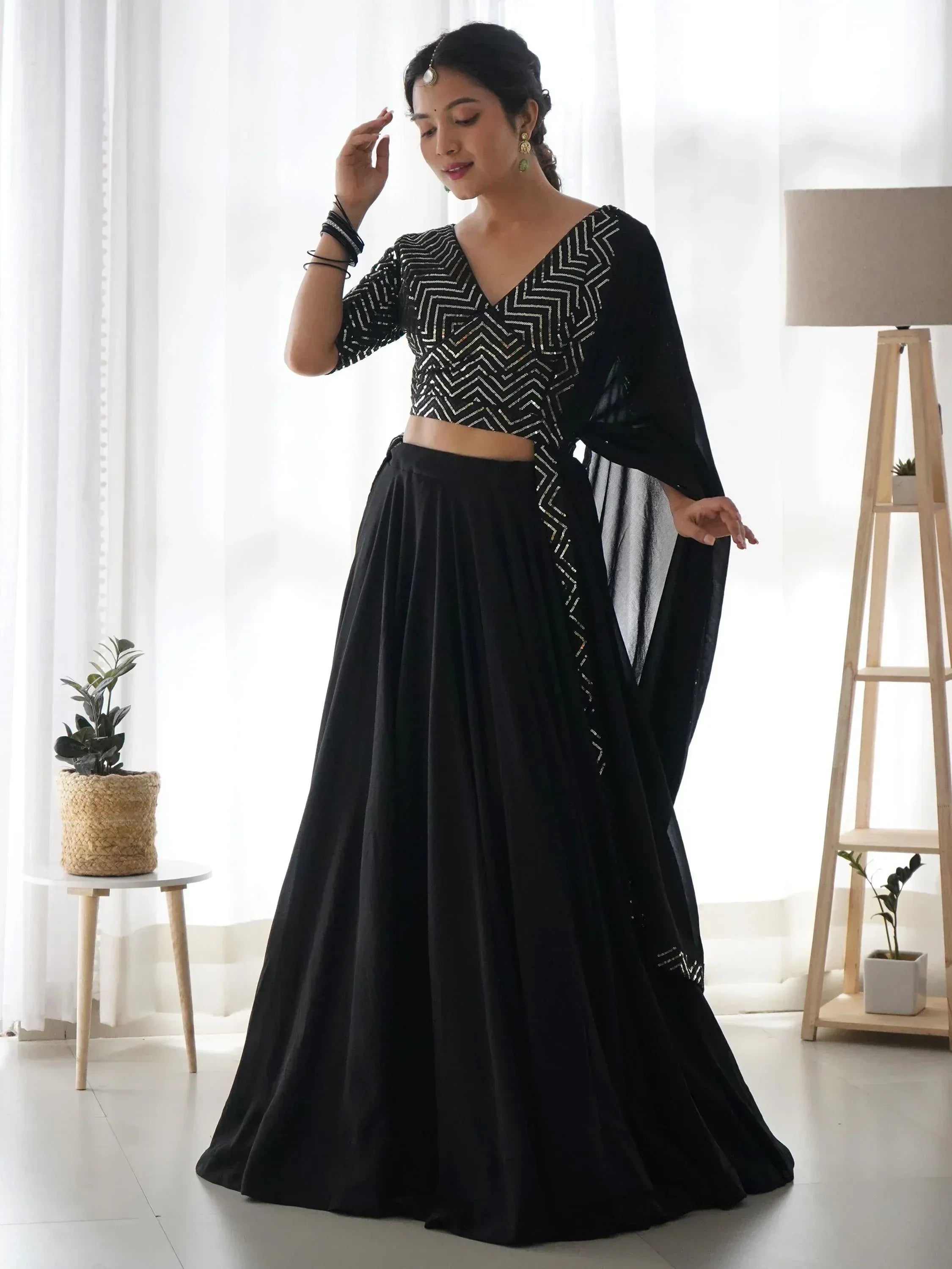 Black designer lehenga choli with geometric sequin work, perfect for Indian ethnic wear events