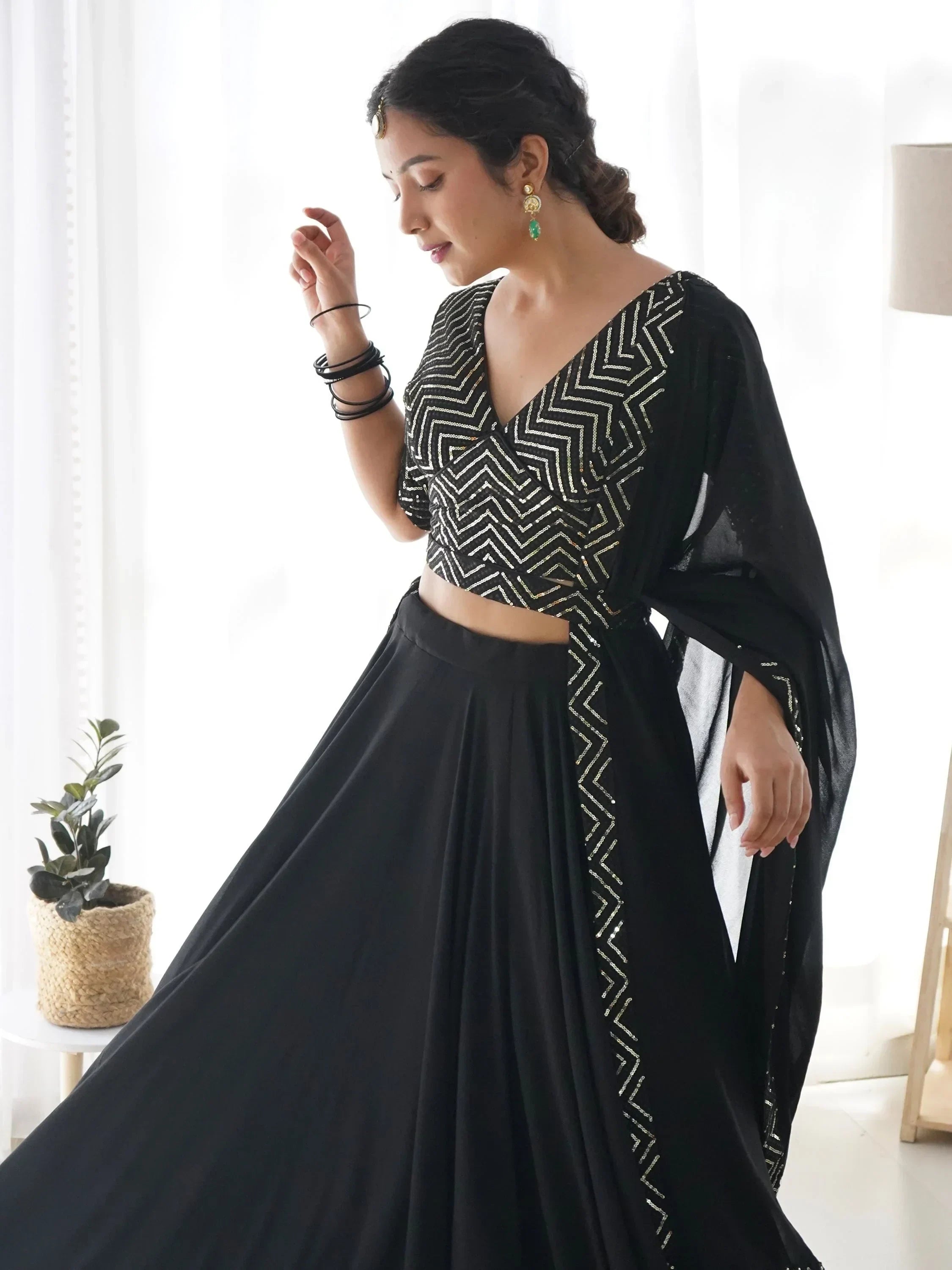Black lehenga choli with gold geometric embroidery, perfect for Indian ethnic wear events