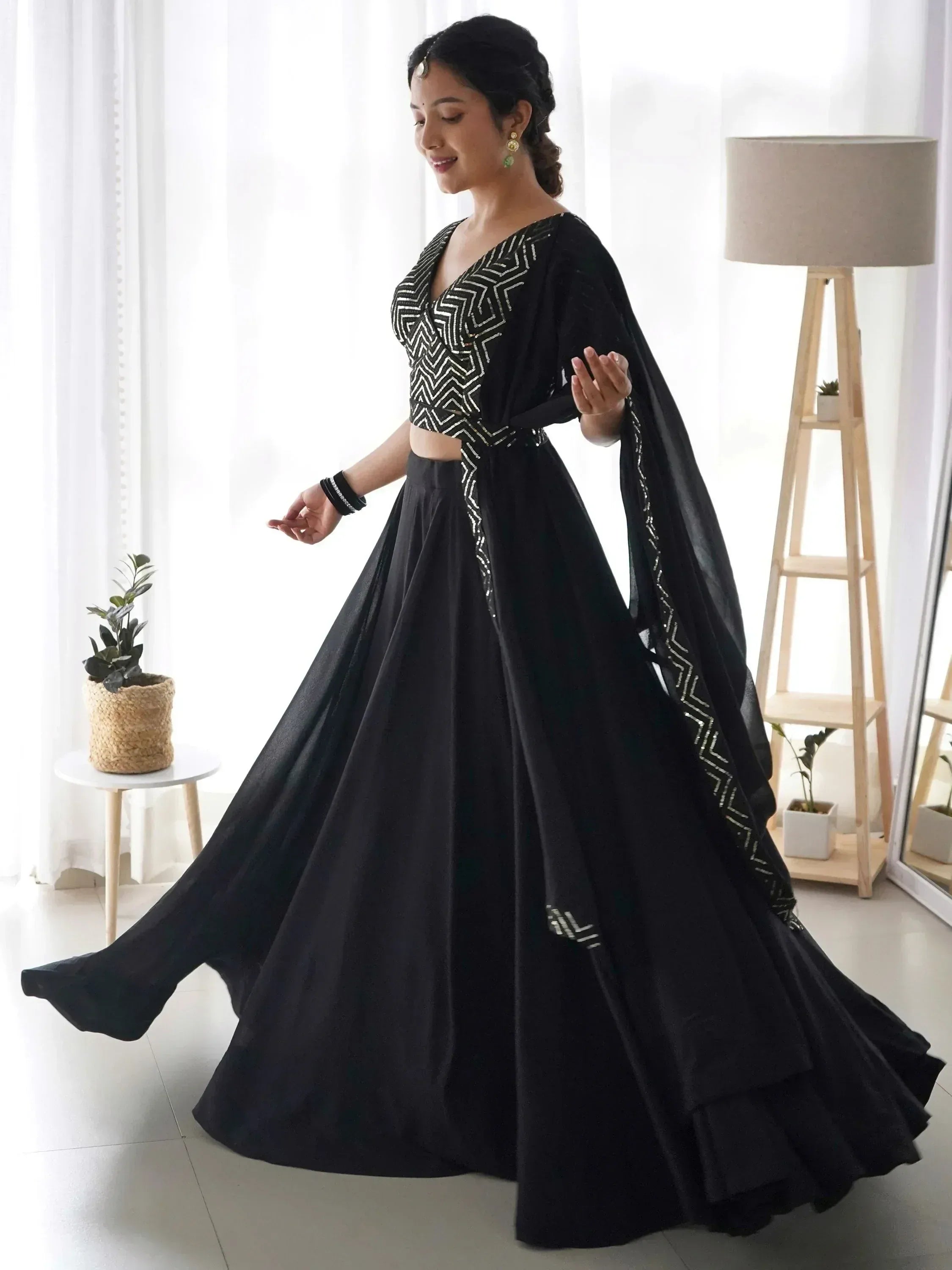 Black designer lehenga choli with geometric embroidery, perfect for Indian ethnic wear events