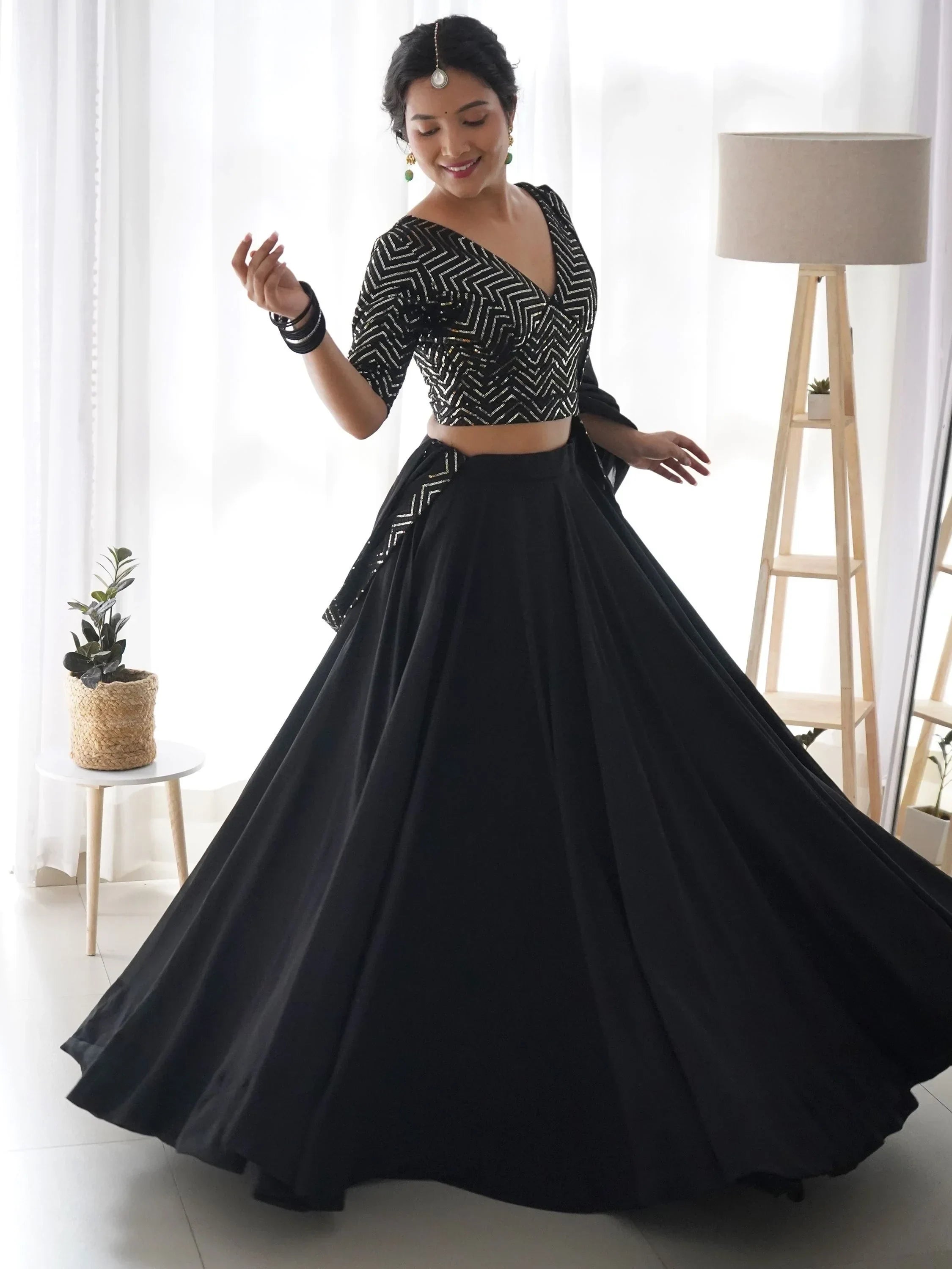 Black lehenga choli with geometric sequin top and flared skirt, perfect for Indian ethnic wear events