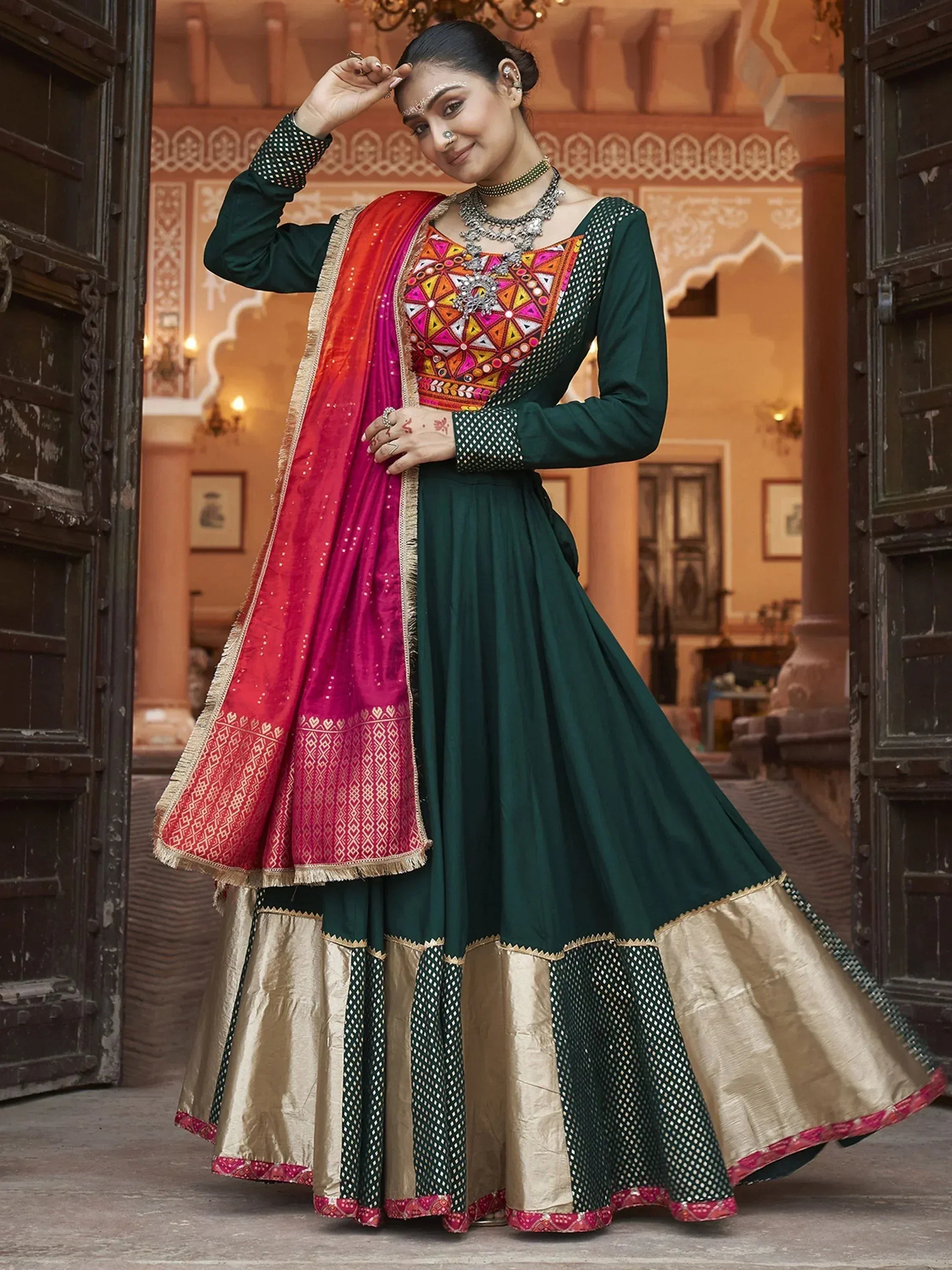 Green and pink embroidered Indian anarkali suit with dupatta, perfect for weddings and festive occasions