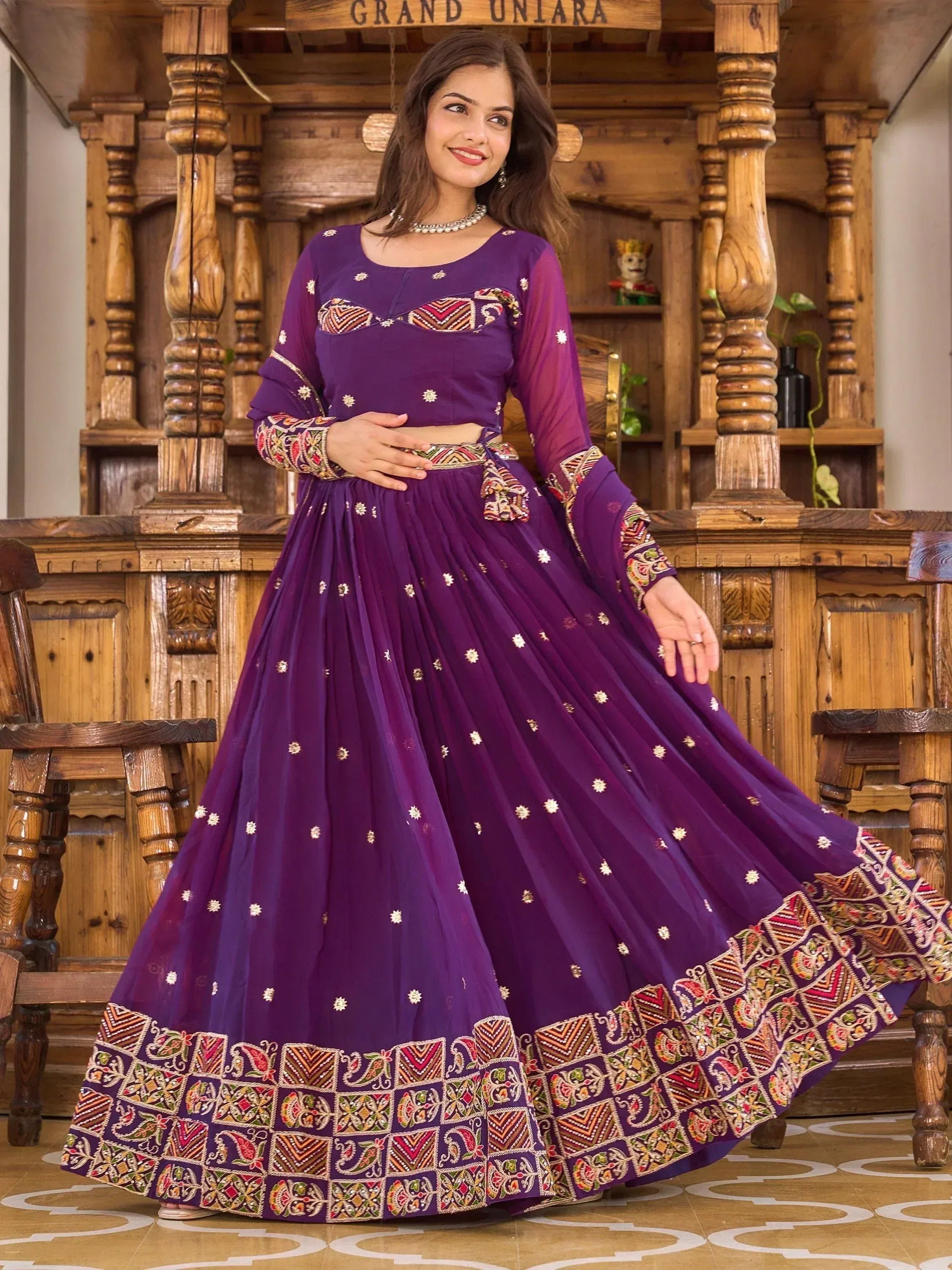 Purple embroidered lehenga choli with floral motifs, perfect for Indian ethnic wear occasions