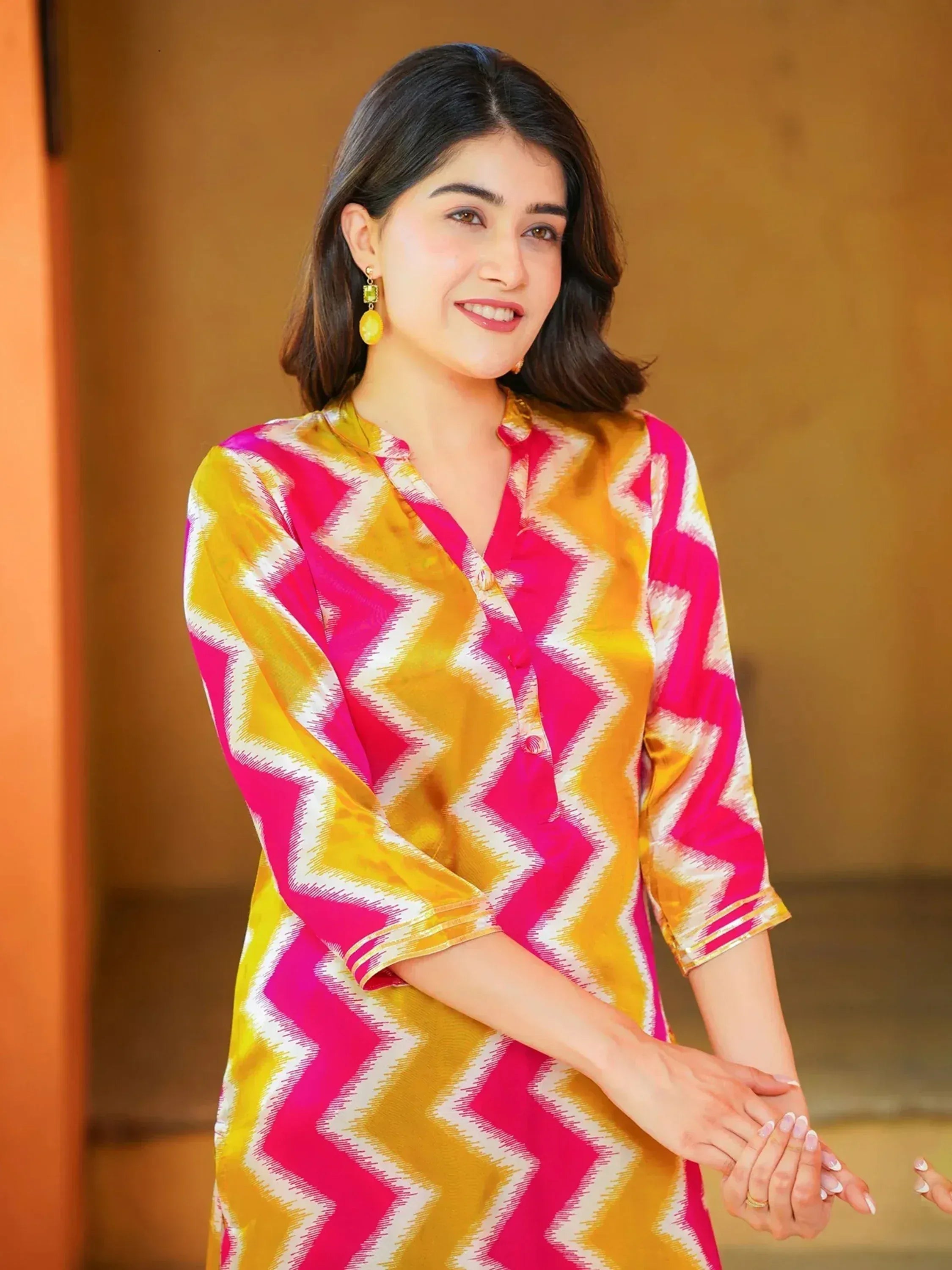 Vibrant pink and yellow chevron print ethnic kurta with button front, perfect for festive occasions.