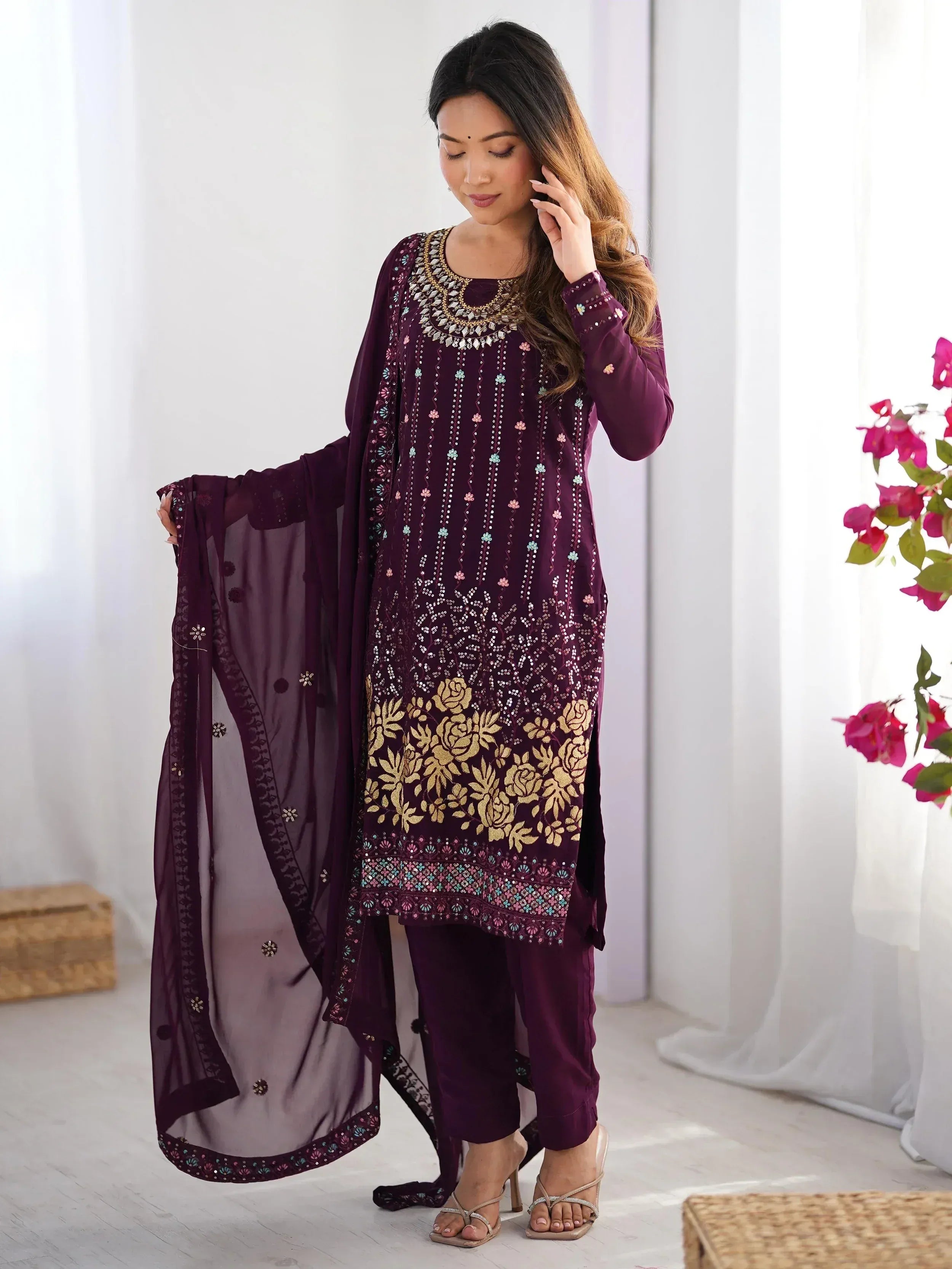 Elegant purple salwar kameez with gold floral embroidery and matching dupatta, perfect for ethnic occasions.