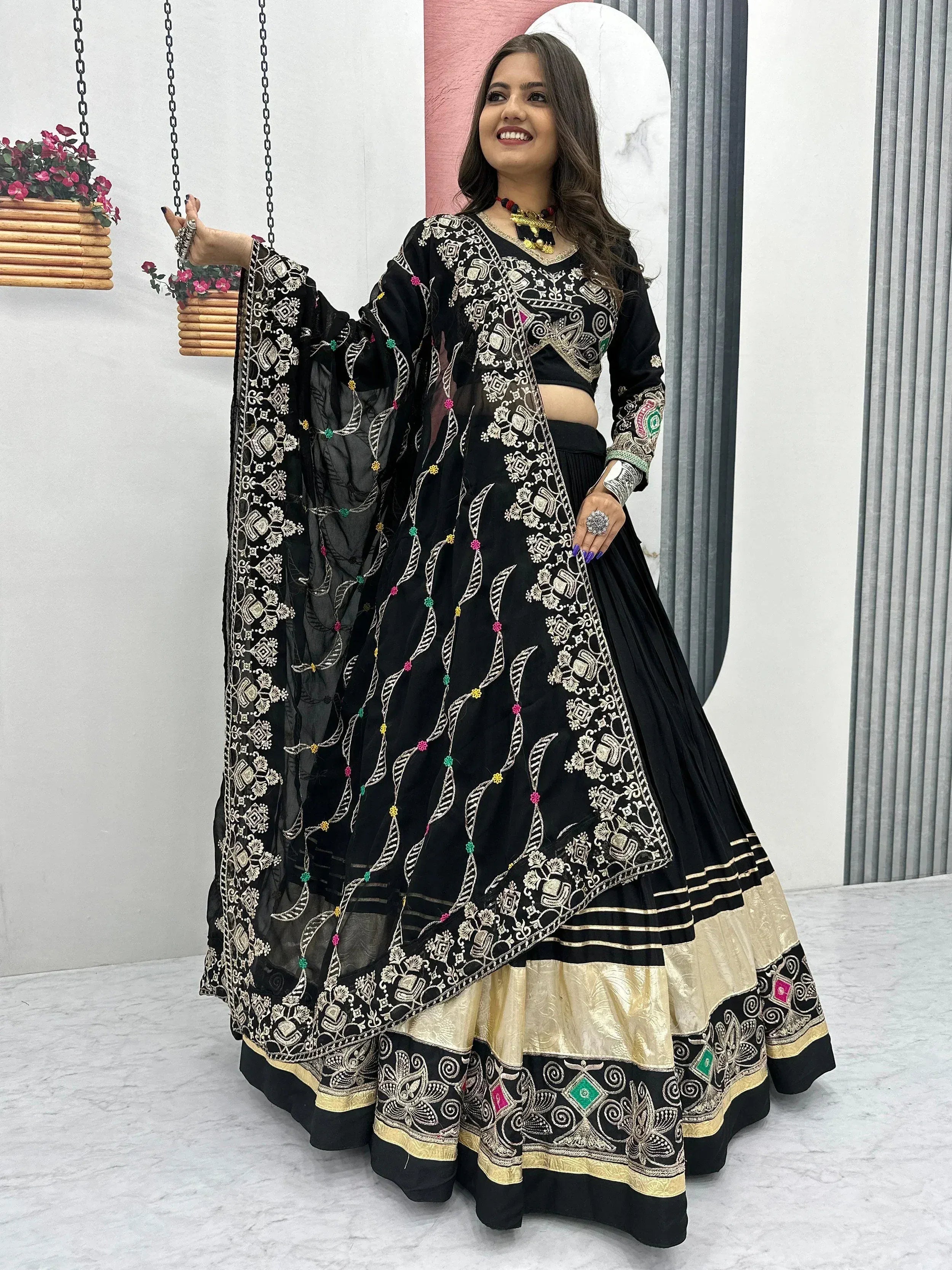 Black embroidered lehenga choli with gold detailing, perfect for Indian ethnic wear occasions