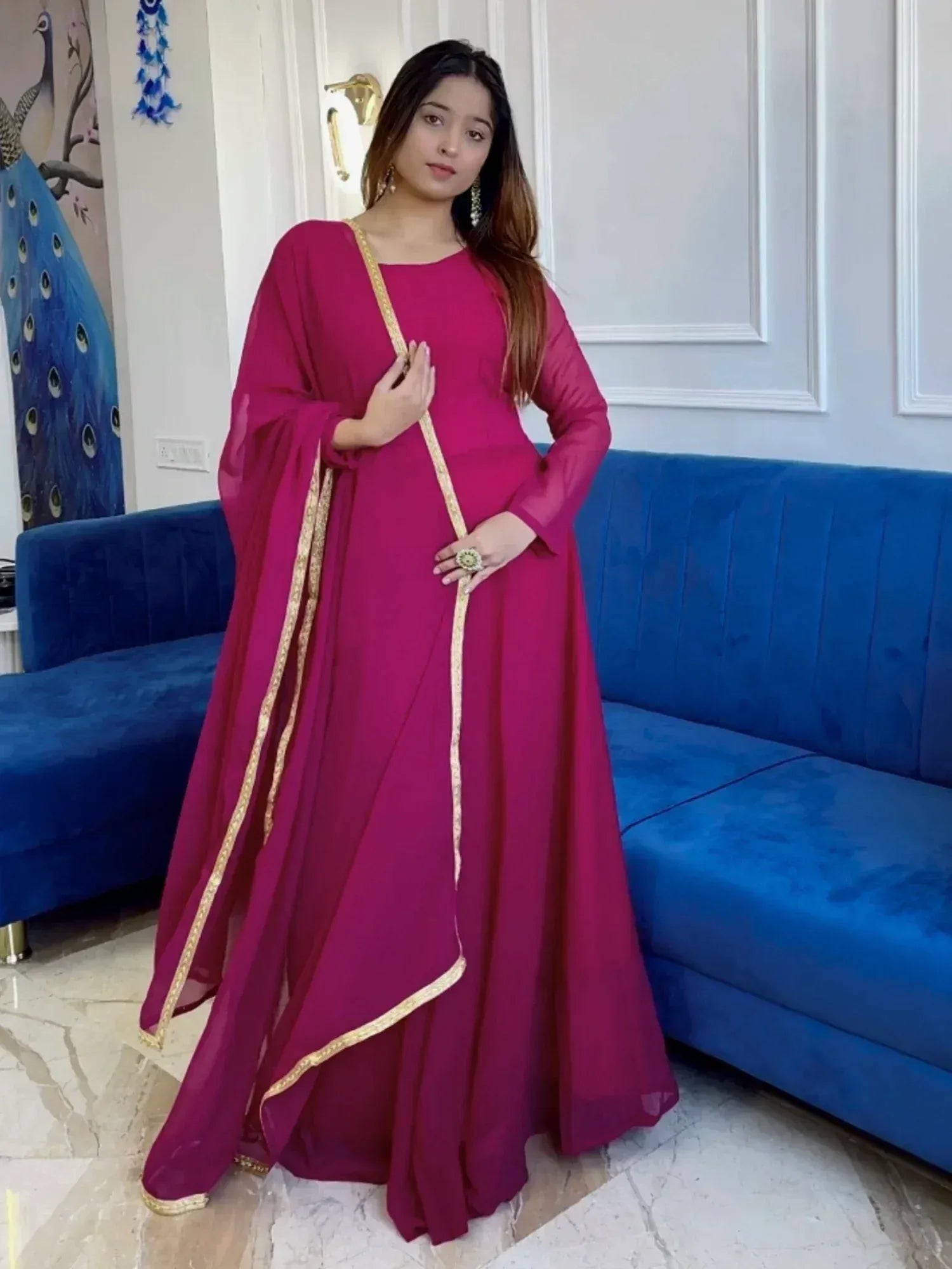 Magenta ethnic gown with gold trim, perfect for Indian occasions and festive wear