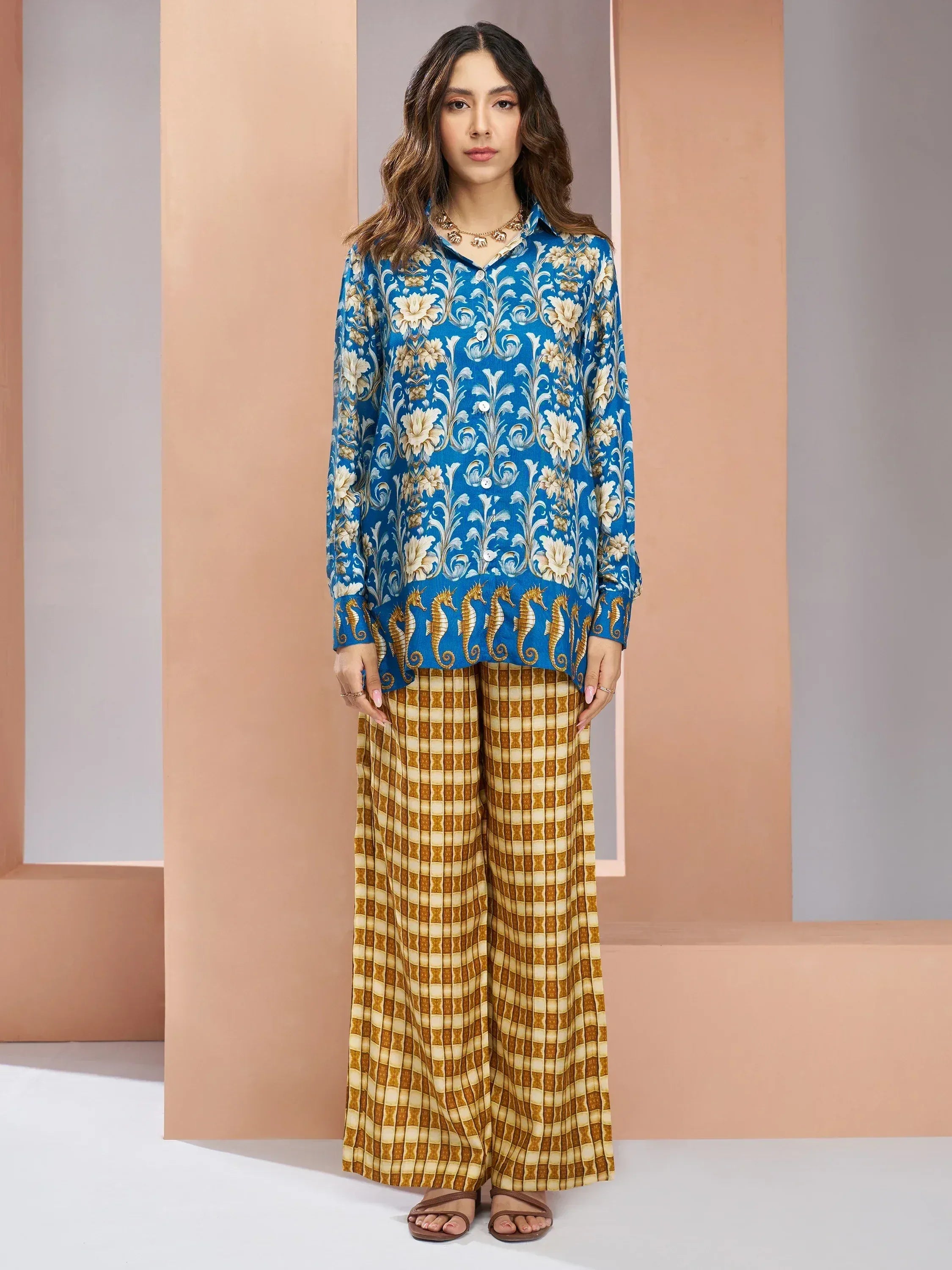 Blue floral printed kurta with seahorse hem paired with checkered palazzo pants, ethnic wear outfit
