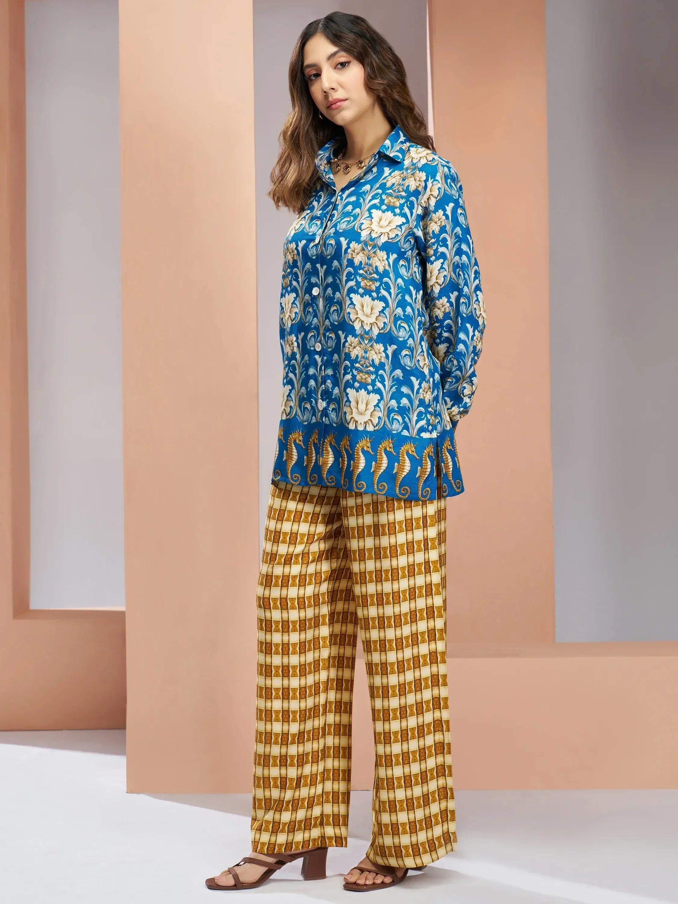 Blue floral kurta with seahorse hem paired with printed palazzo pants, ethnic wear for women
