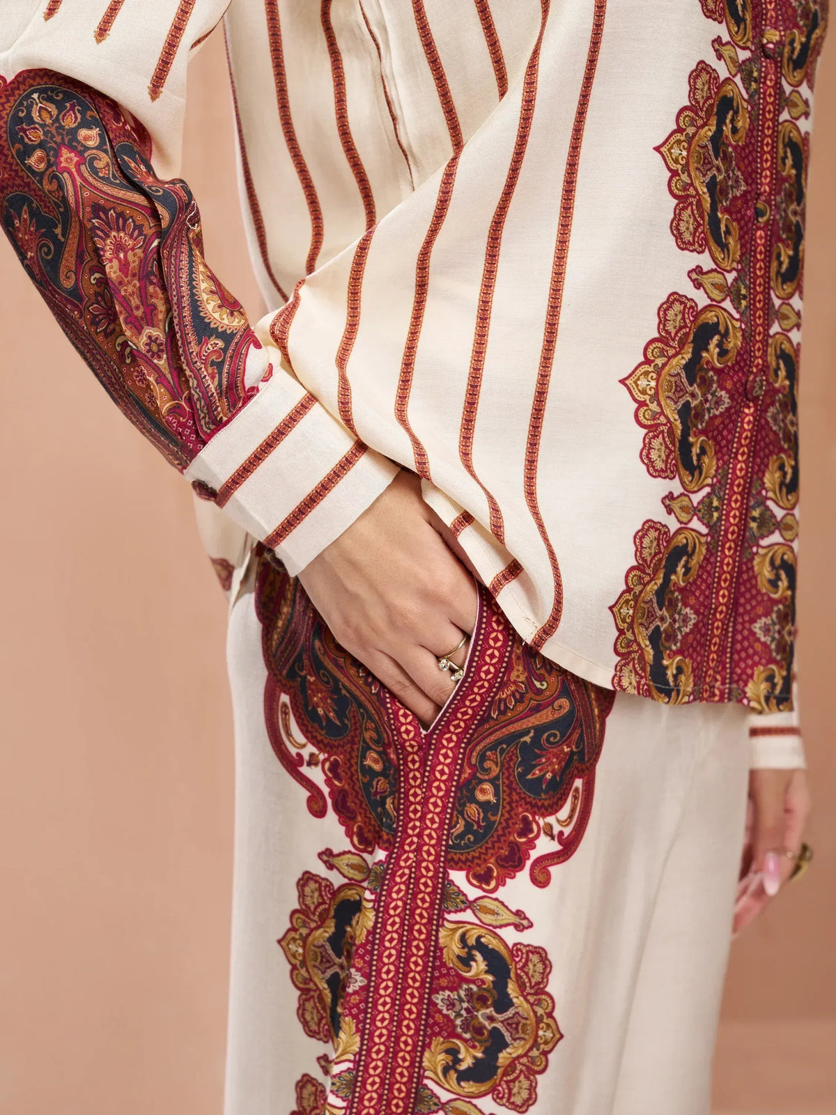 Cream ethnic kurta with red and gold paisley print, perfect for Indian festive wear