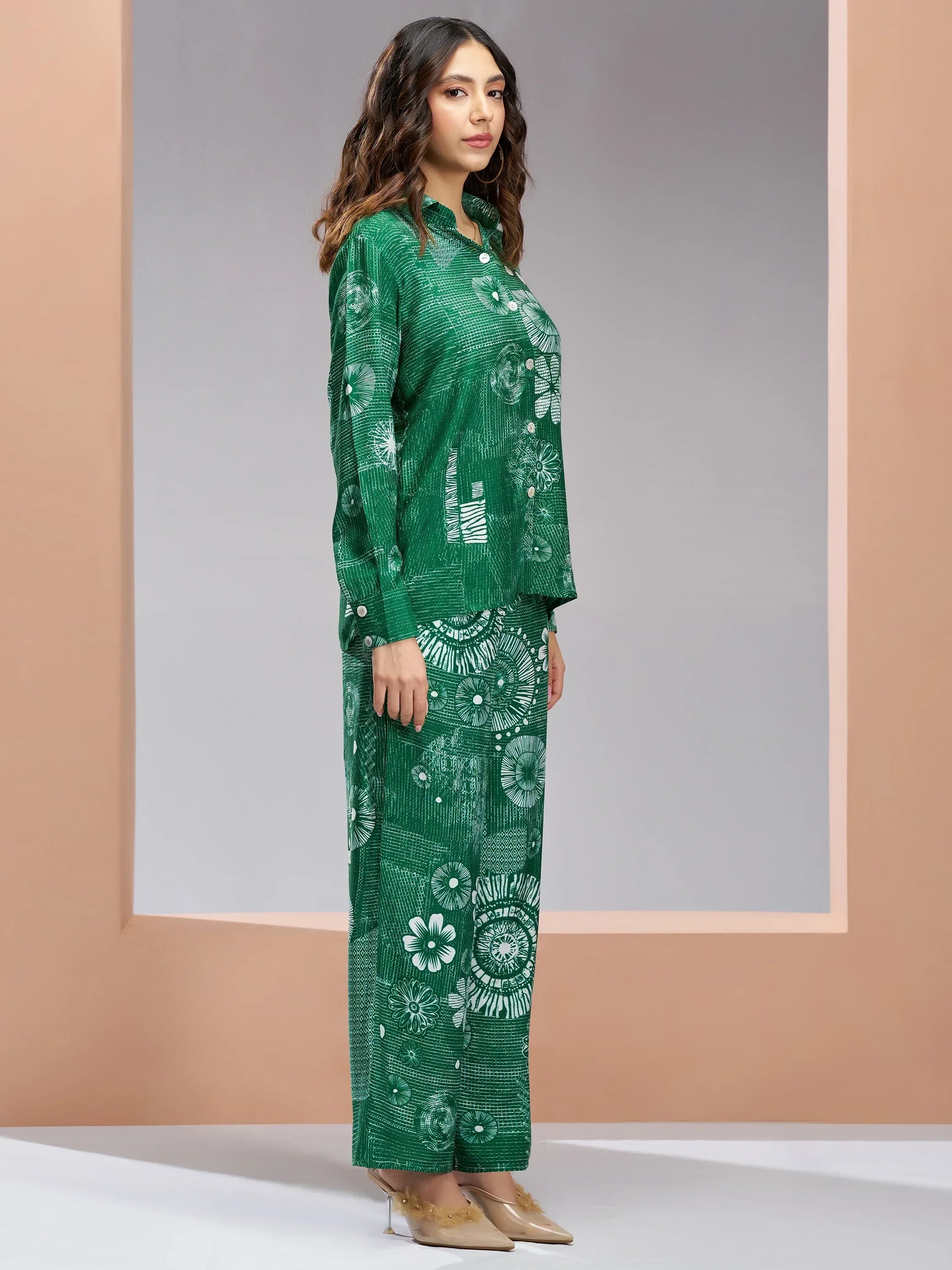 Woman in green printed ethnic kurta set with floral patterns, side profile view