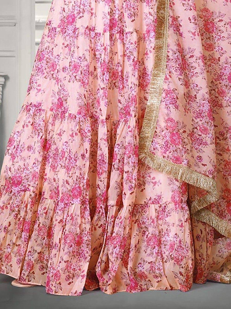 Pink floral lehenga choli with gold trim, ethnic Indian wear for weddings and festivals