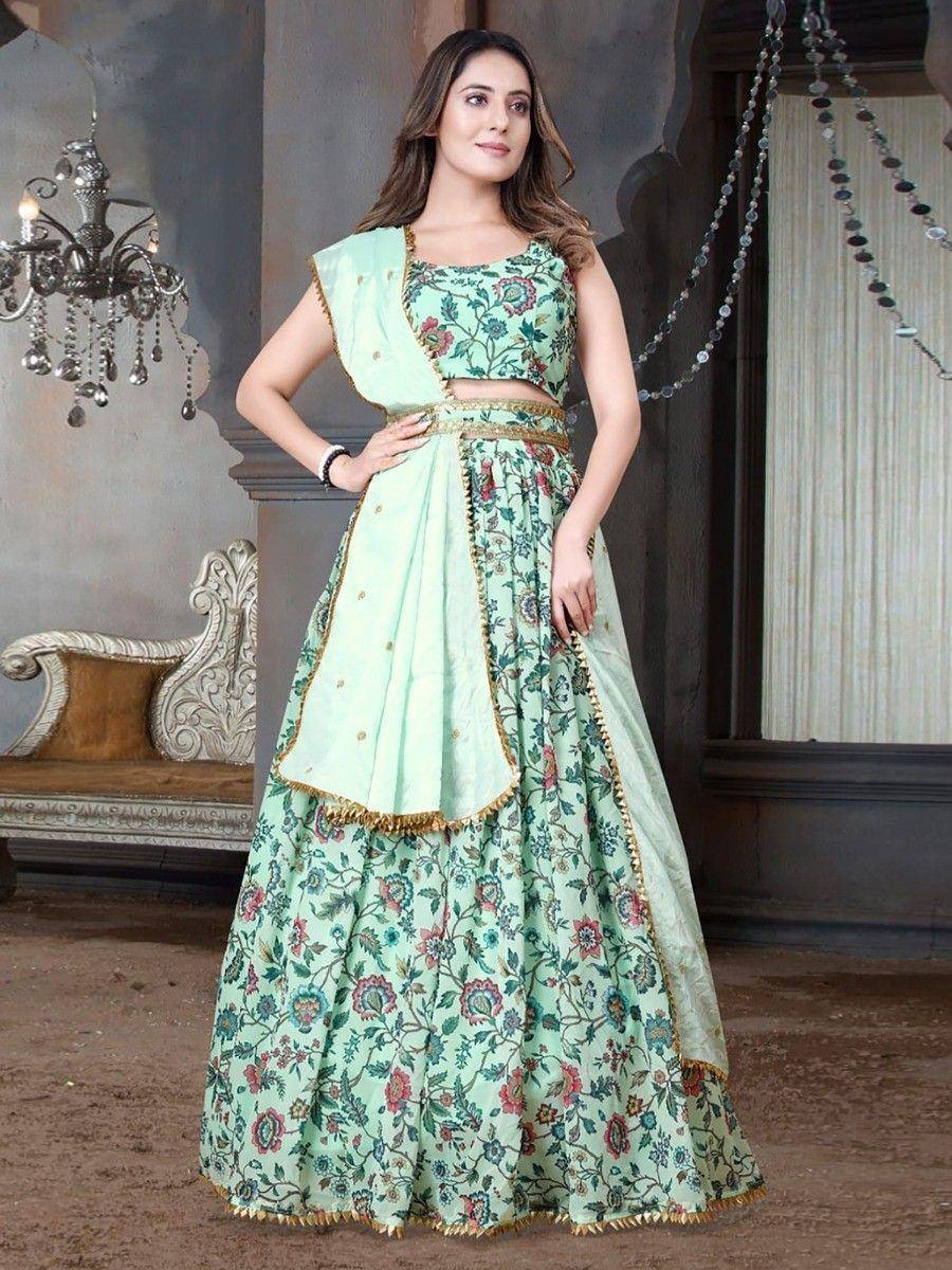 Mint green floral lehenga choli with gold trim, perfect for Indian ethnic occasions and weddings.