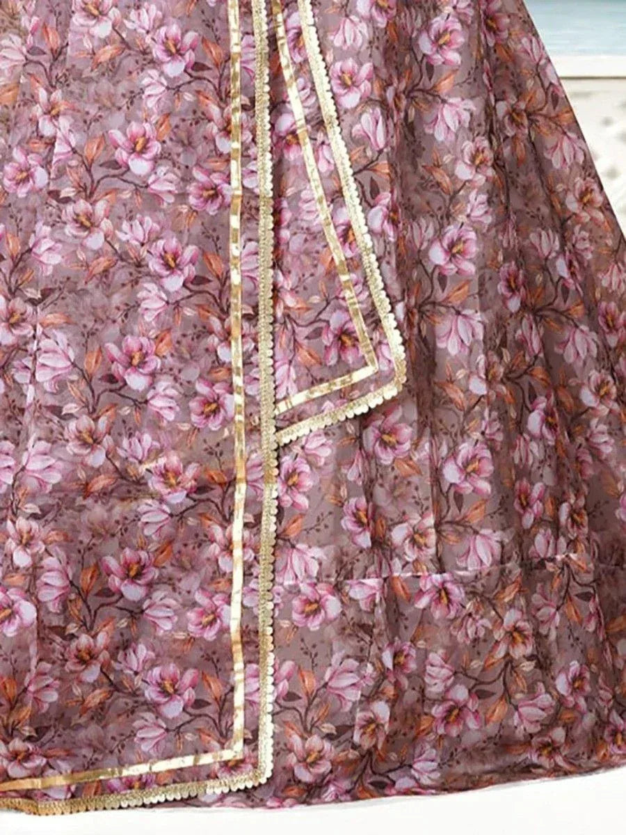 Floral print ethnic gown with gold trim, perfect for Indian occasions and festive wear.