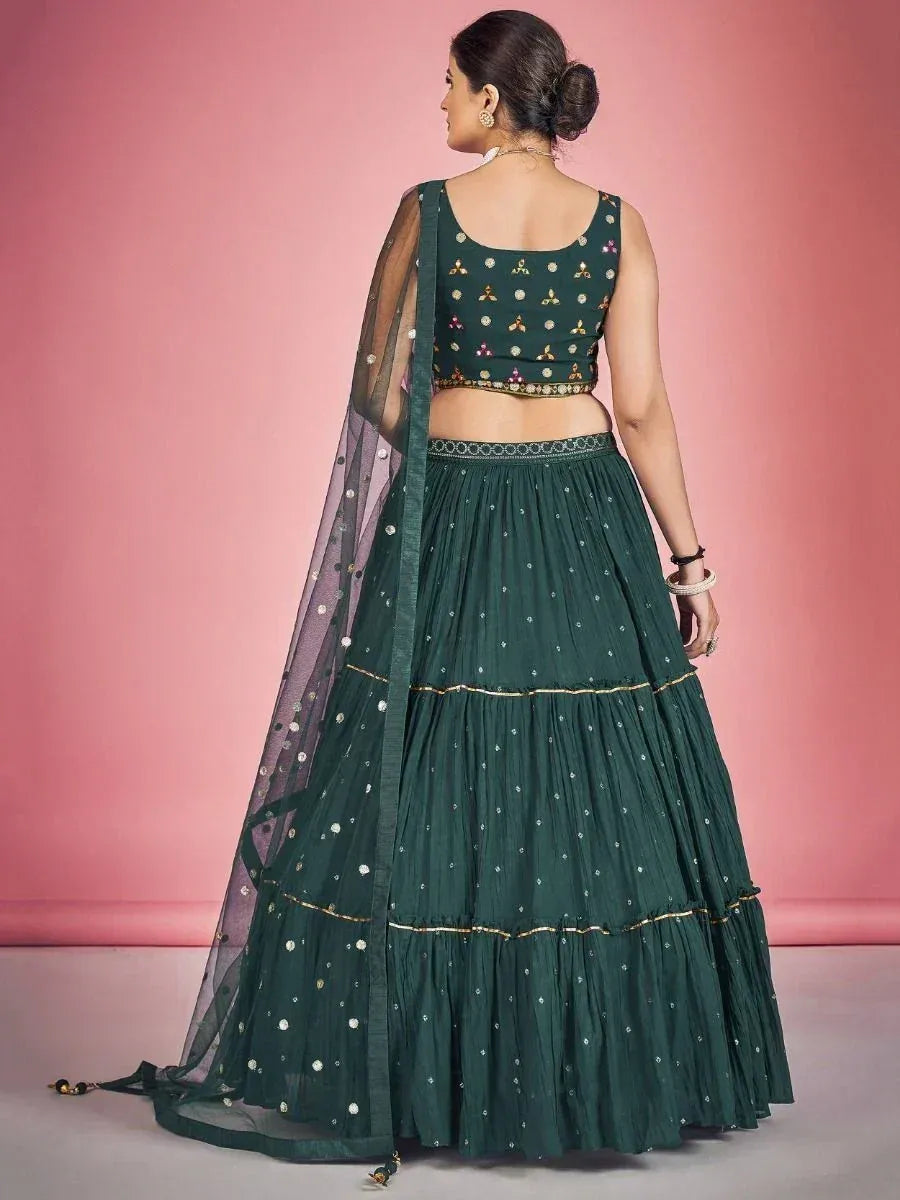 Emerald green embroidered lehenga choli with sheer dupatta, perfect for Indian ethnic wear occasions