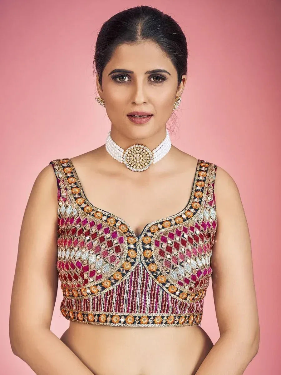 Embroidered ethnic blouse with mirror work, perfect for lehenga choli or saree, paired with pearl choker necklace