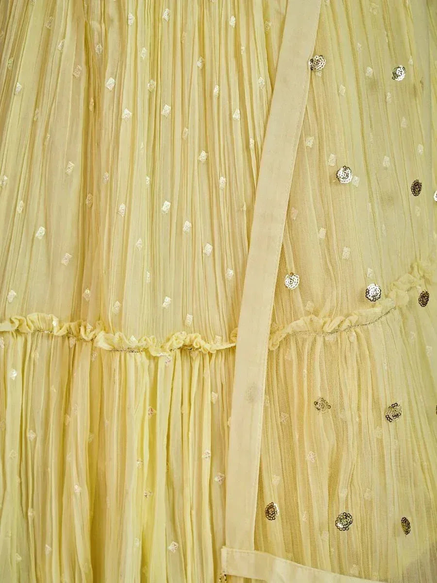 Yellow pleated ethnic gown with sequin embellishments and ruffled hem detail