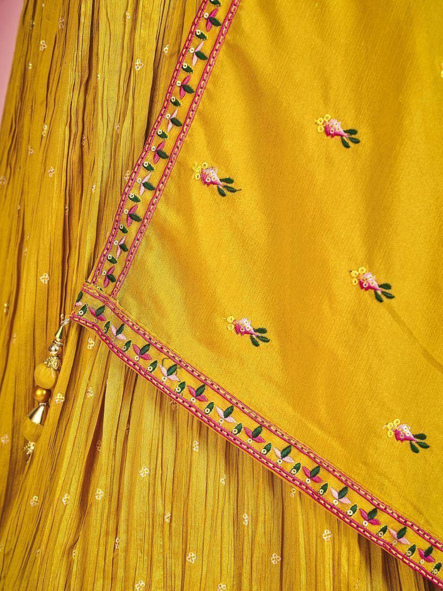Yellow ethnic lehenga with floral embroidery and pleated skirt detail
