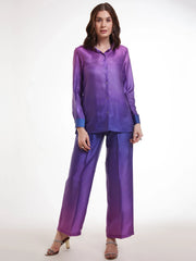 Woman wearing a purple ombre satin shirt and palazzo pant set from Ethnic Plus