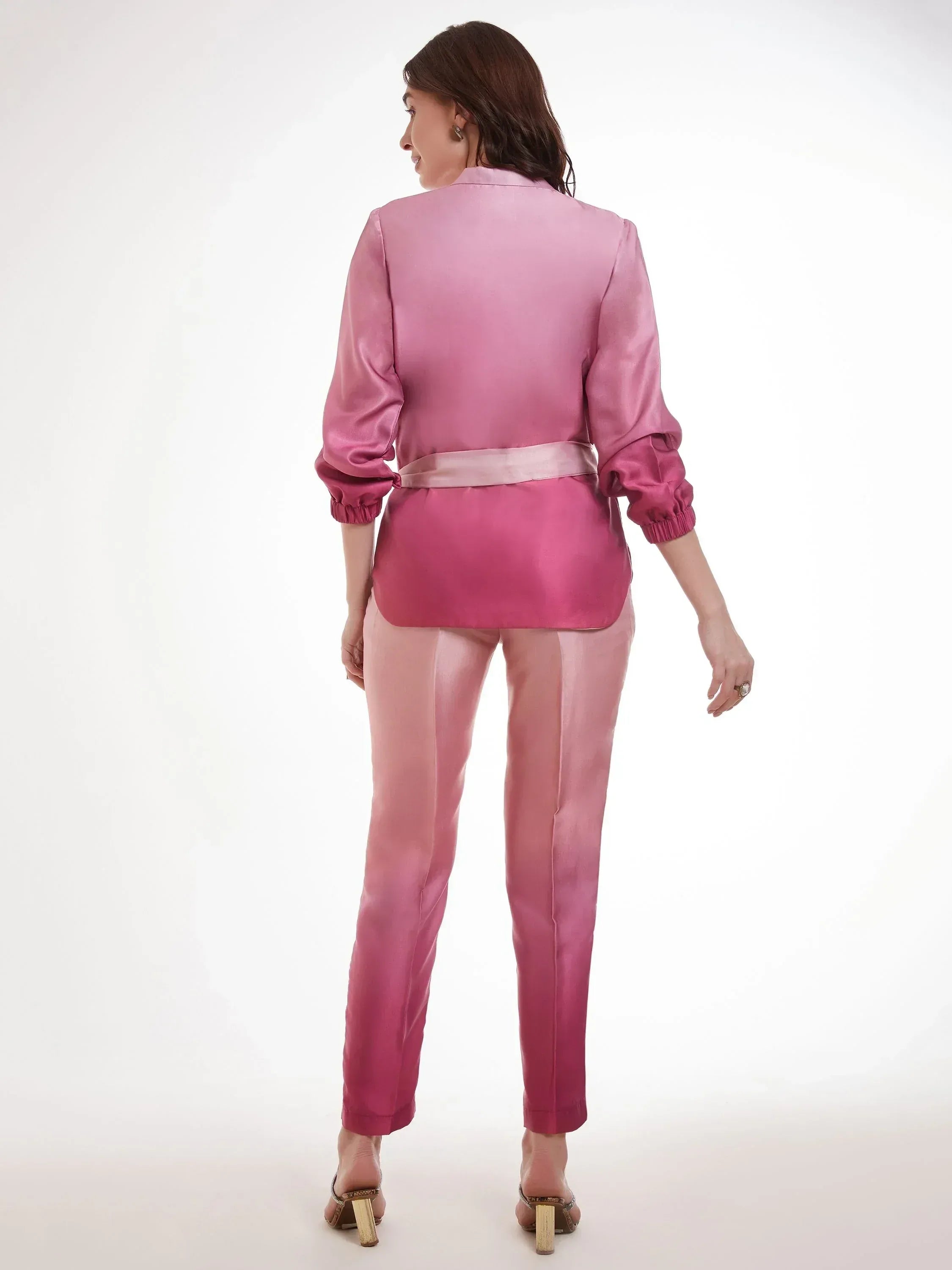 Woman wearing pink ombre satin ethnic suit set with belt and full sleeves, back view