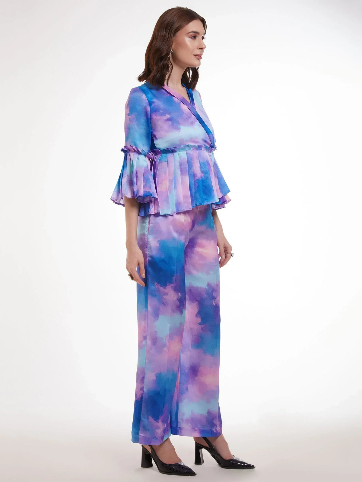 Woman in blue purple tie-dye ethnic palazzo set with ruffled top, stylish Indian wear