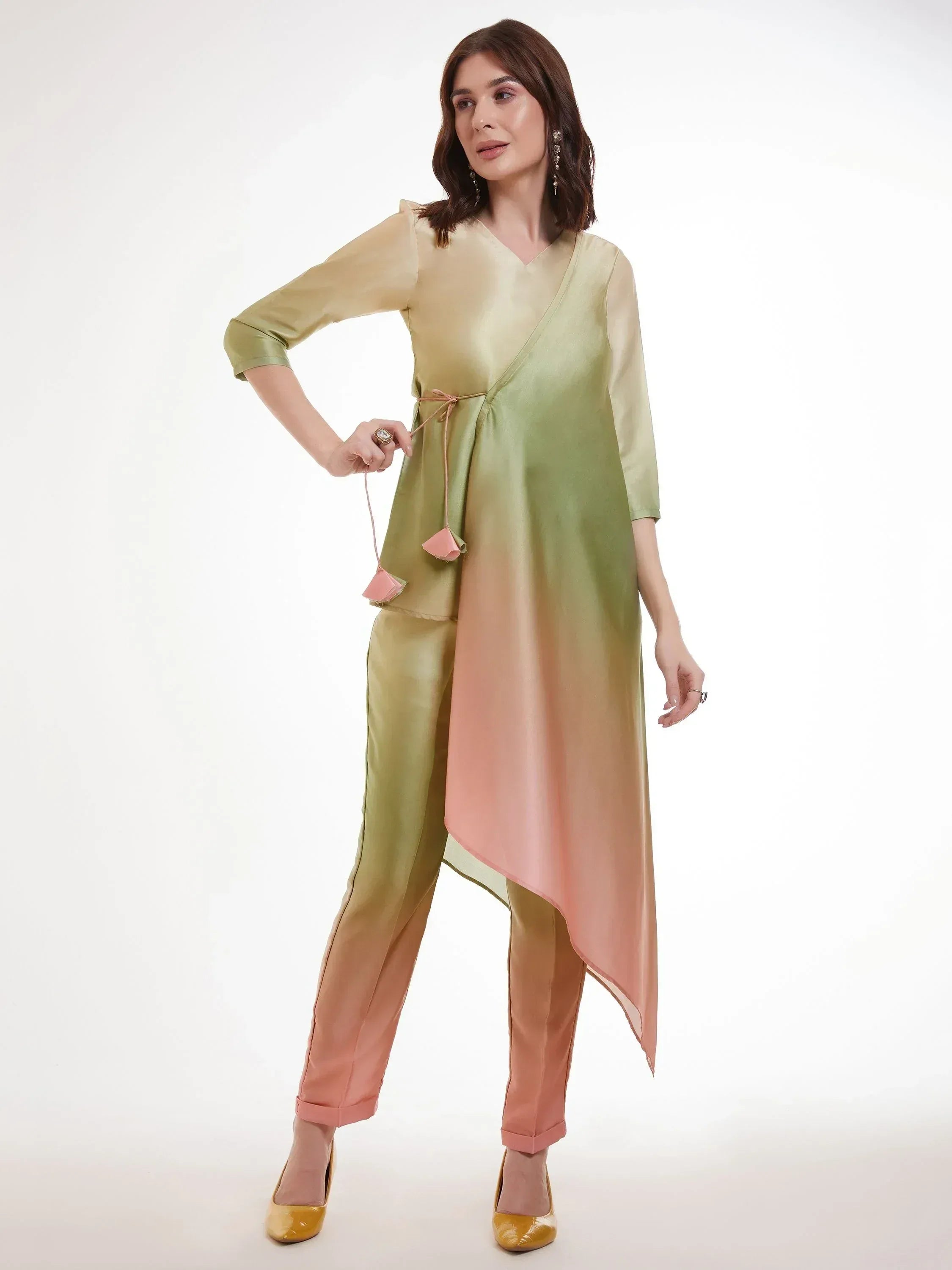 Woman wearing pastel ombre salwar kameez with asymmetrical kurta and pants, indian ethnic wear
