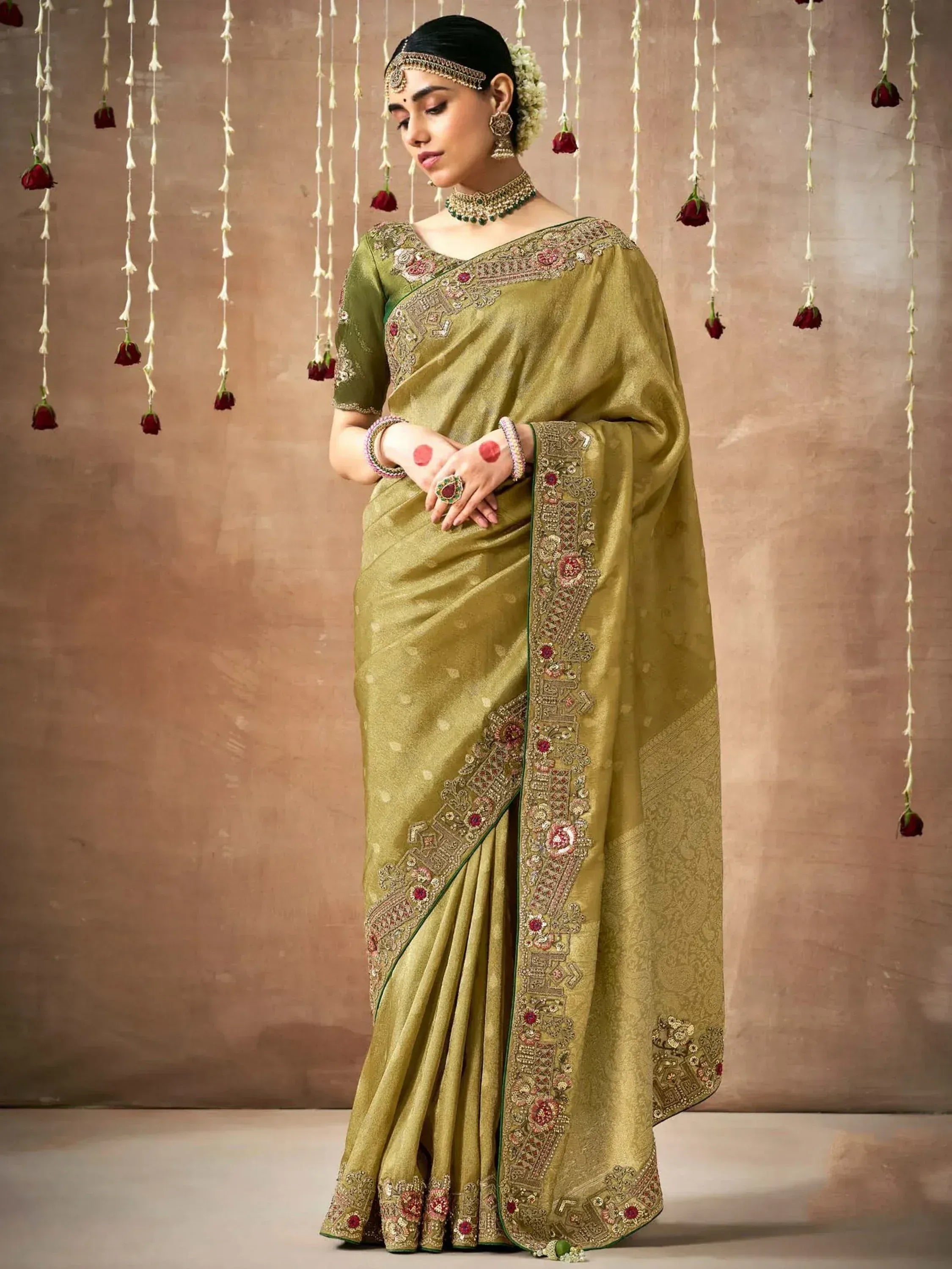 Olive green embroidered saree with heavy border, perfect for Indian ethnic wear and festive occasions.