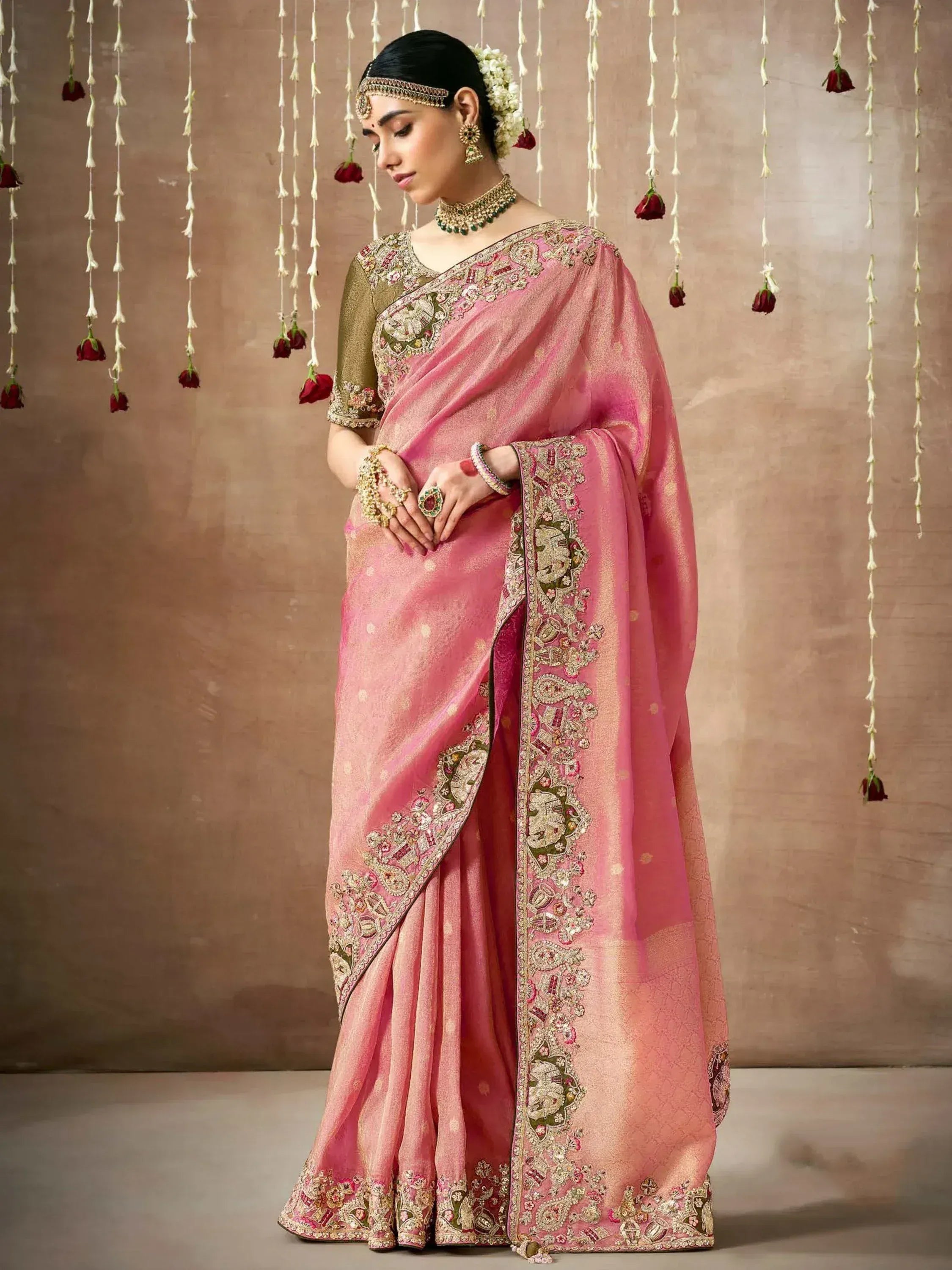 Pink embroidered saree with gold detailing, perfect for Indian ethnic wear and festive occasions.