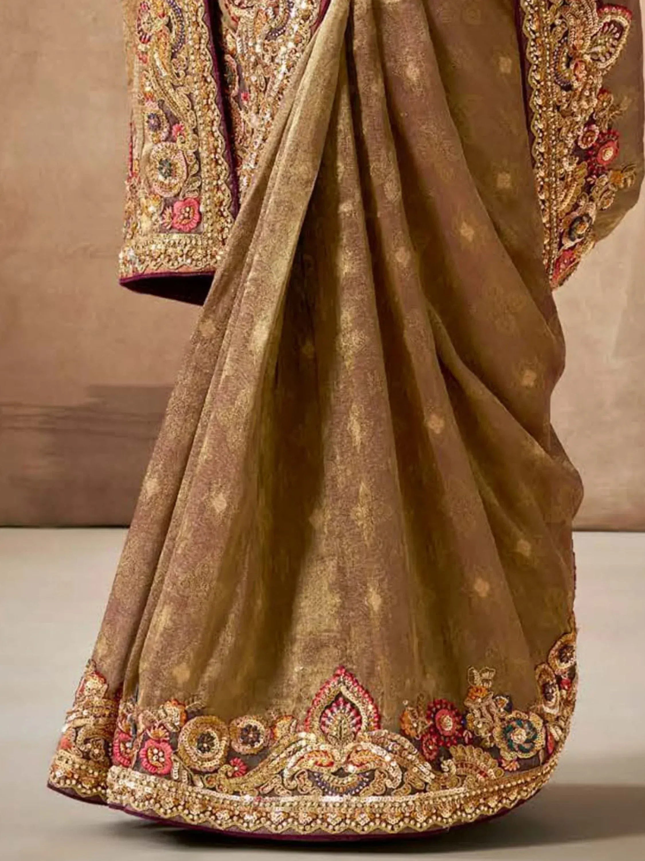 Luxury gold lehenga with intricate floral embroidery and sequin work, perfect for Indian weddings.