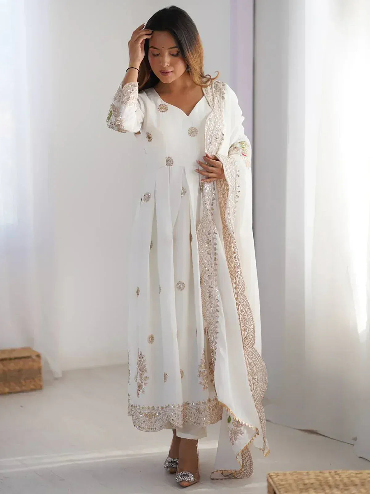 Elegant white embroidered anarkali suit with gold detailing, perfect for Indian ethnic occasions