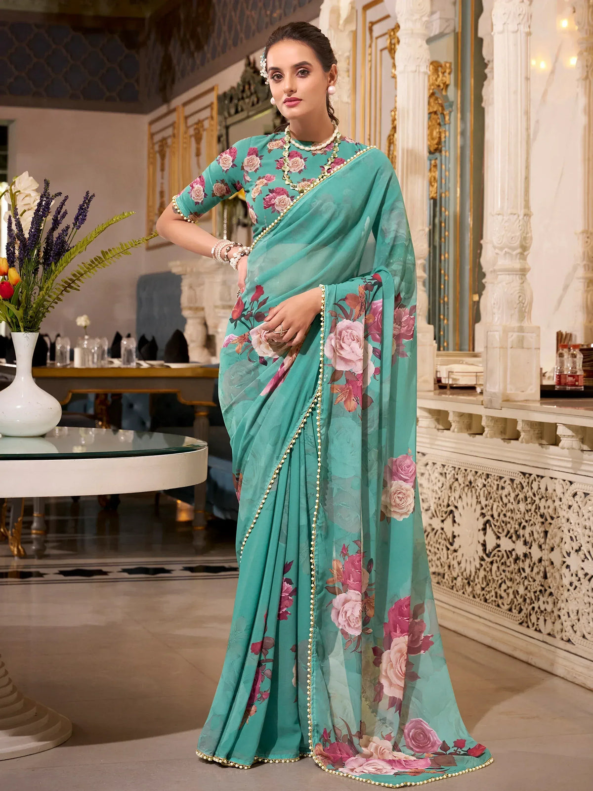 Teal floral saree with pearl border, elegant Indian ethnic wear for women