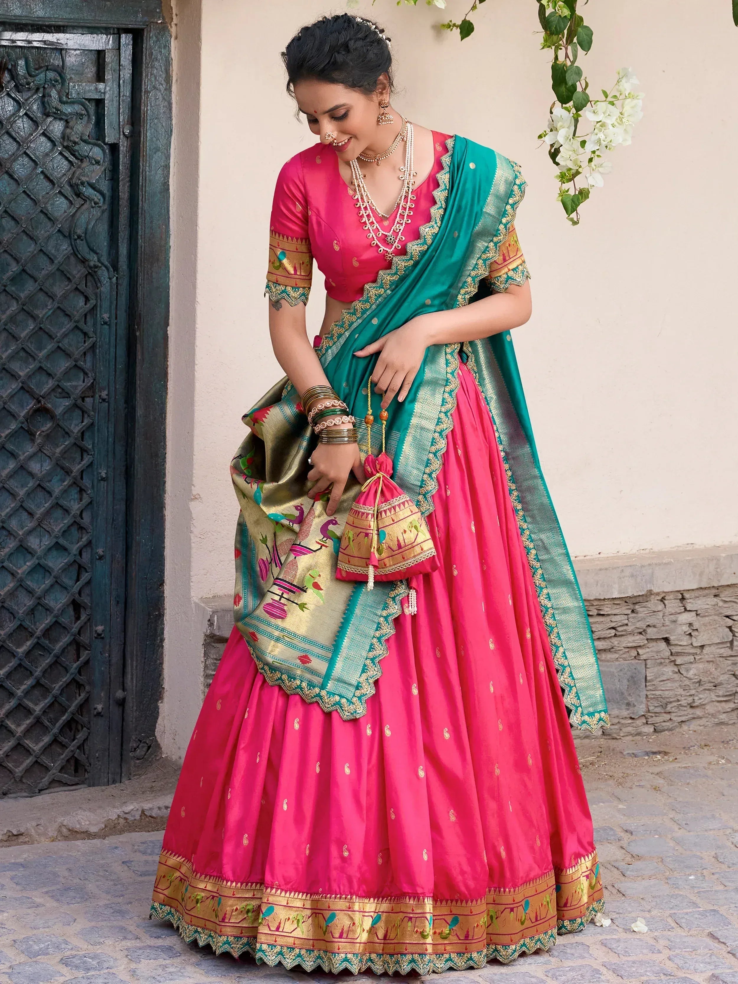 Pink and teal designer lehenga choli with embroidered dupatta, perfect for Indian ethnic occasions