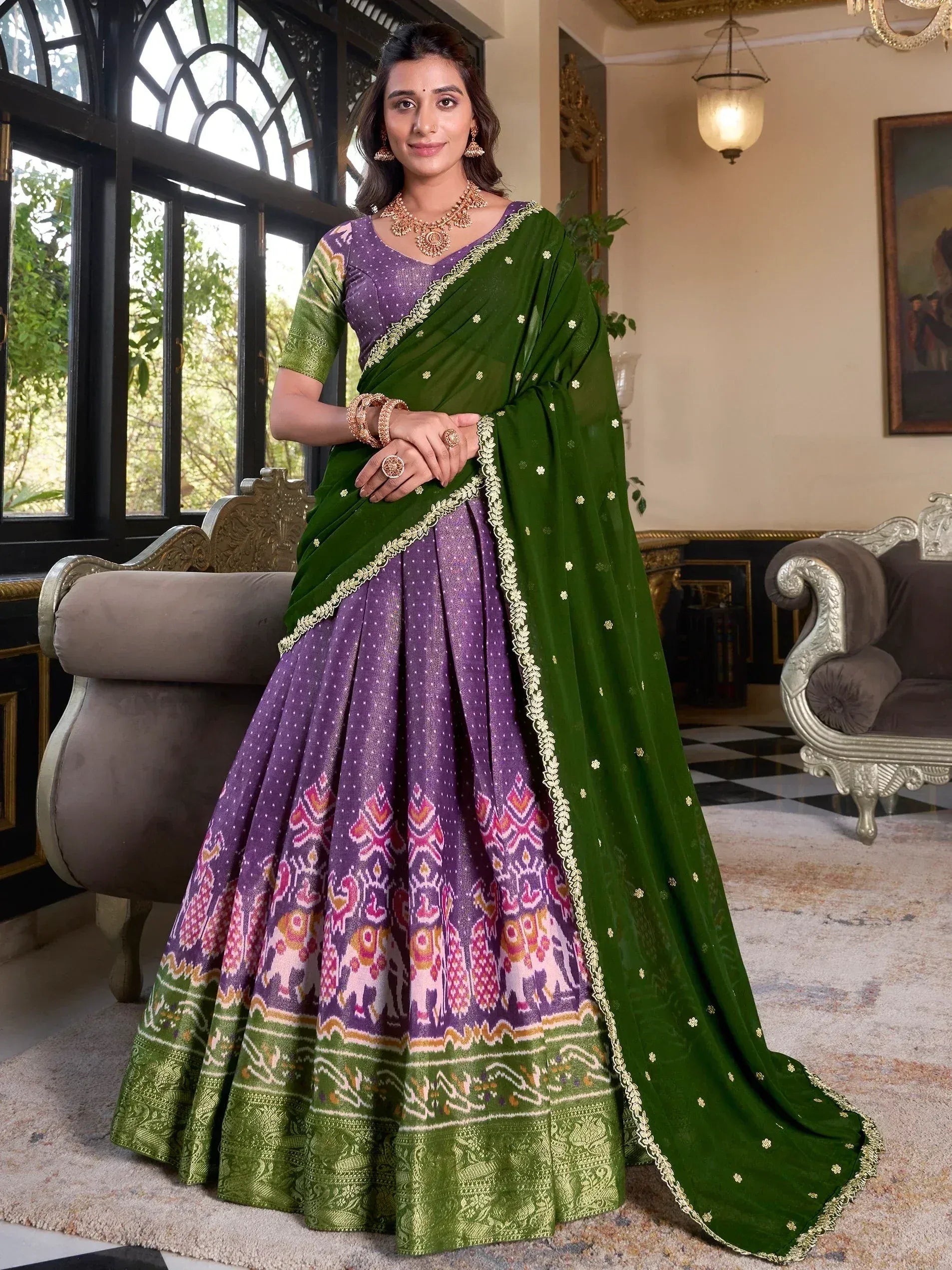 Purple and green ethnic lehenga choli with floral border and elephant print, perfect for Indian weddings and festivals
