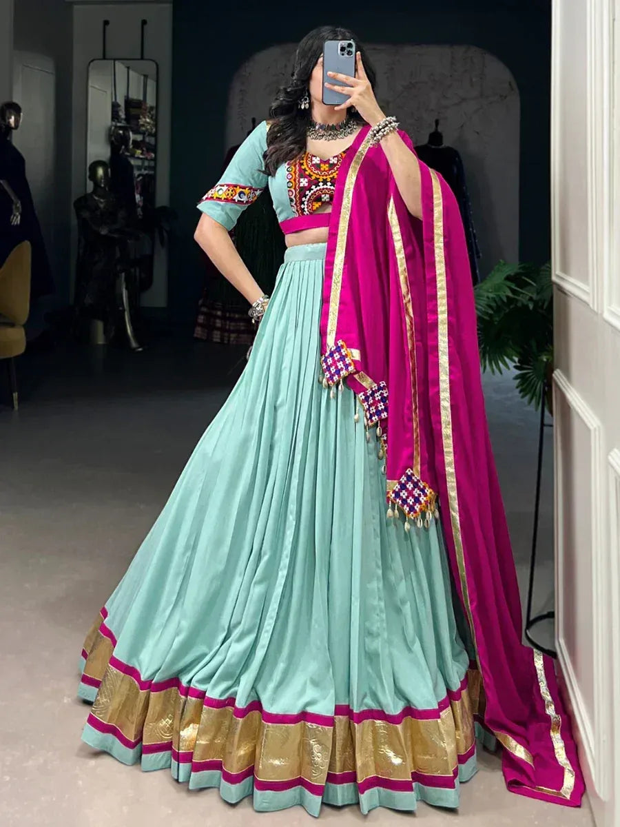 Mint green lehenga choli with pink dupatta, embroidered blouse, gold border, ethnic Indian wear