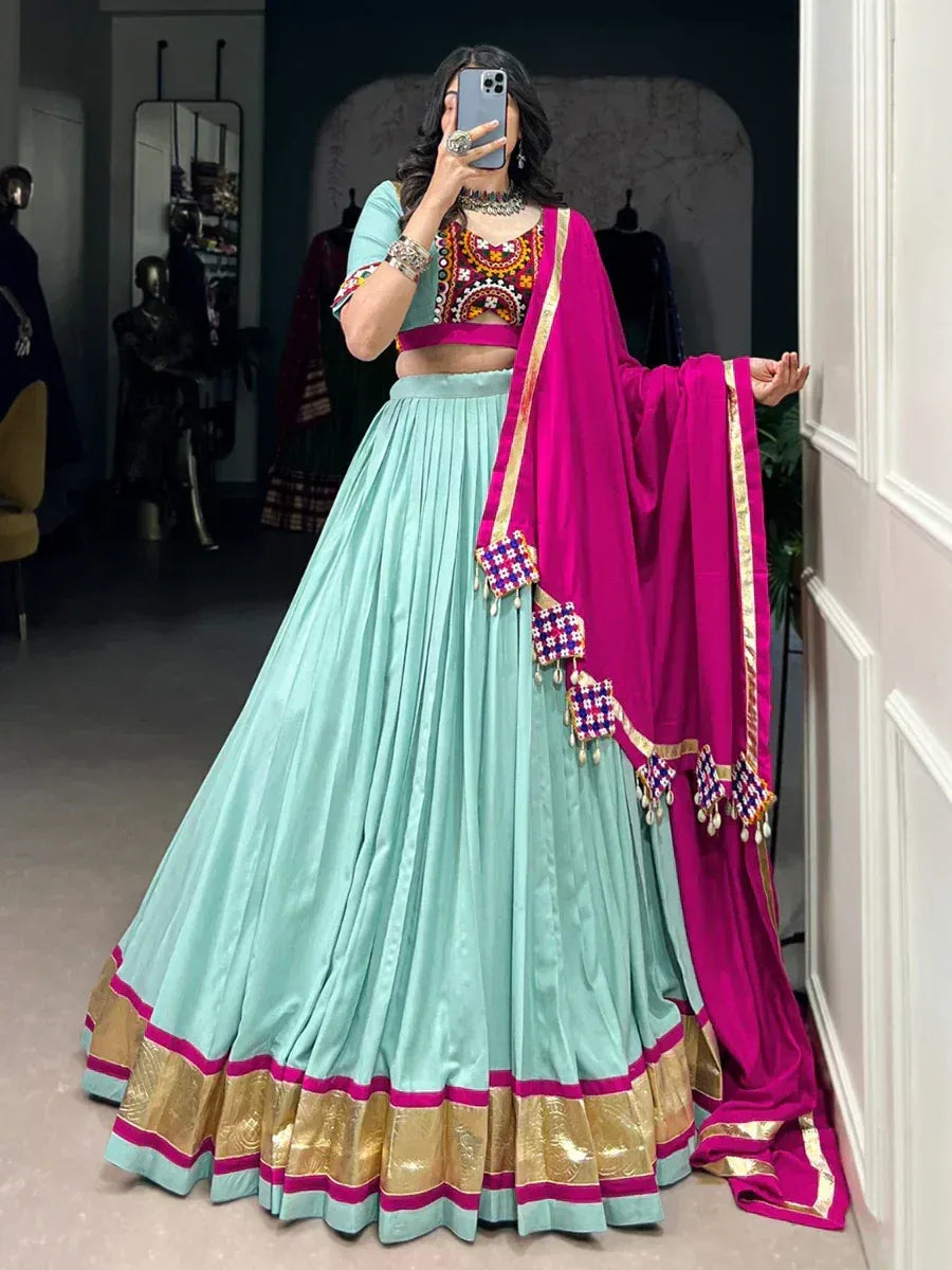 Mint green lehenga choli with pink dupatta, embroidered blouse, gold border, ethnic Indian wear