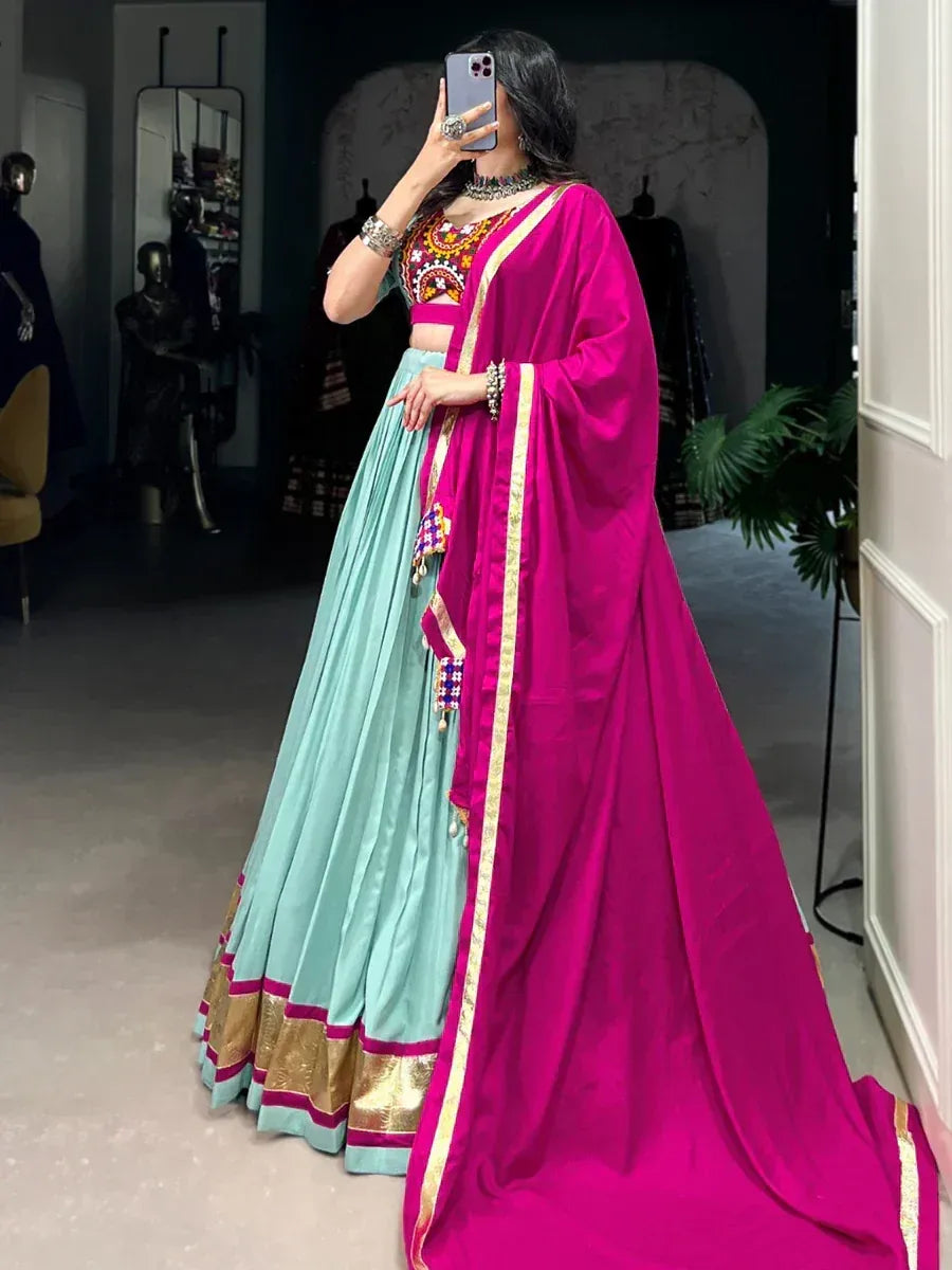 Pink and mint green designer lehenga choli with gold embroidery, perfect for Indian ethnic wear occasions
