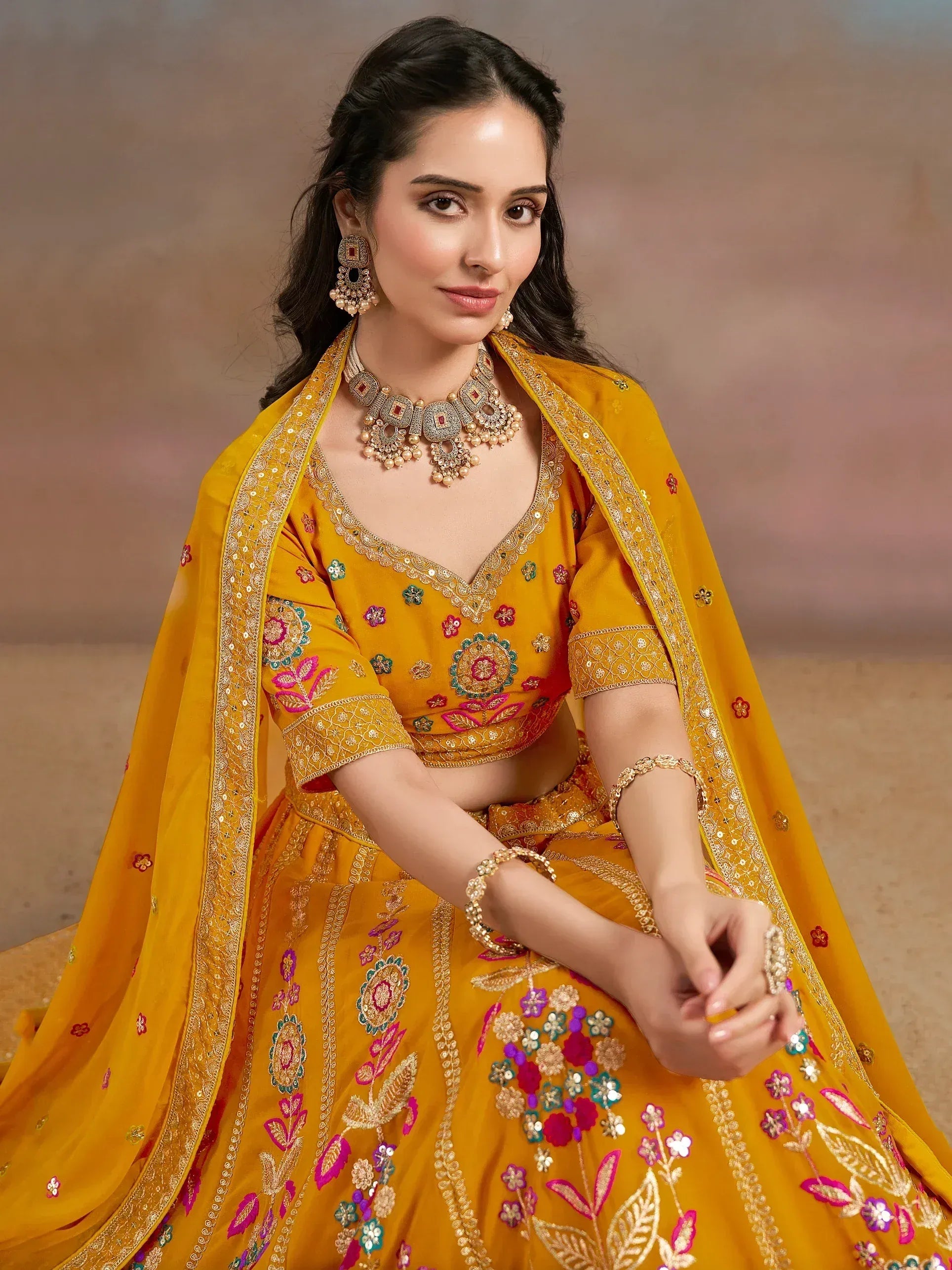 Yellow floral embroidered lehenga choli with dupatta, perfect for Indian weddings and festive occasions
