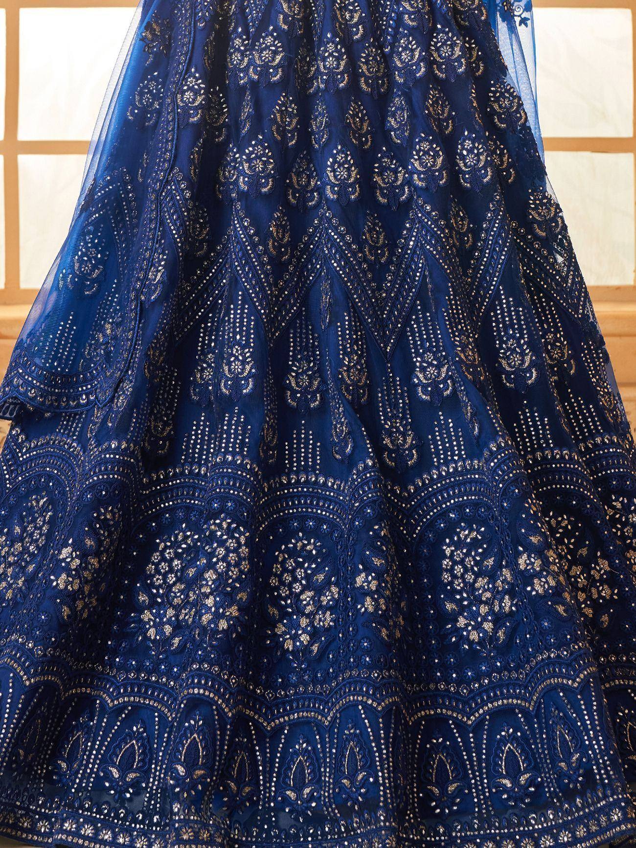 Royal blue designer lehenga with gold embroidery and beadwork, perfect for Indian weddings and festive occasions