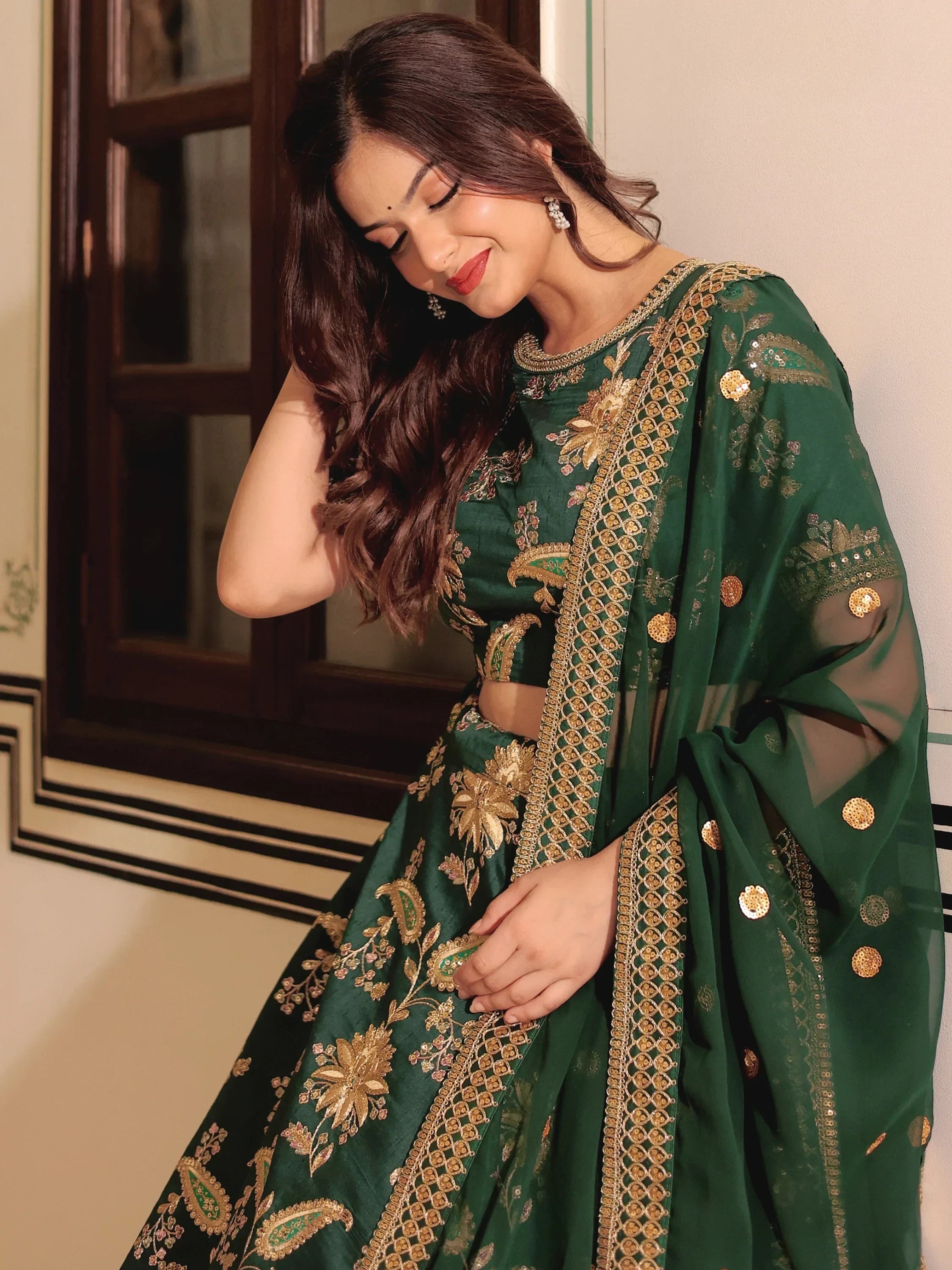 Emerald green designer lehenga choli with gold embroidery and sheer dupatta for Indian ethnic wear
