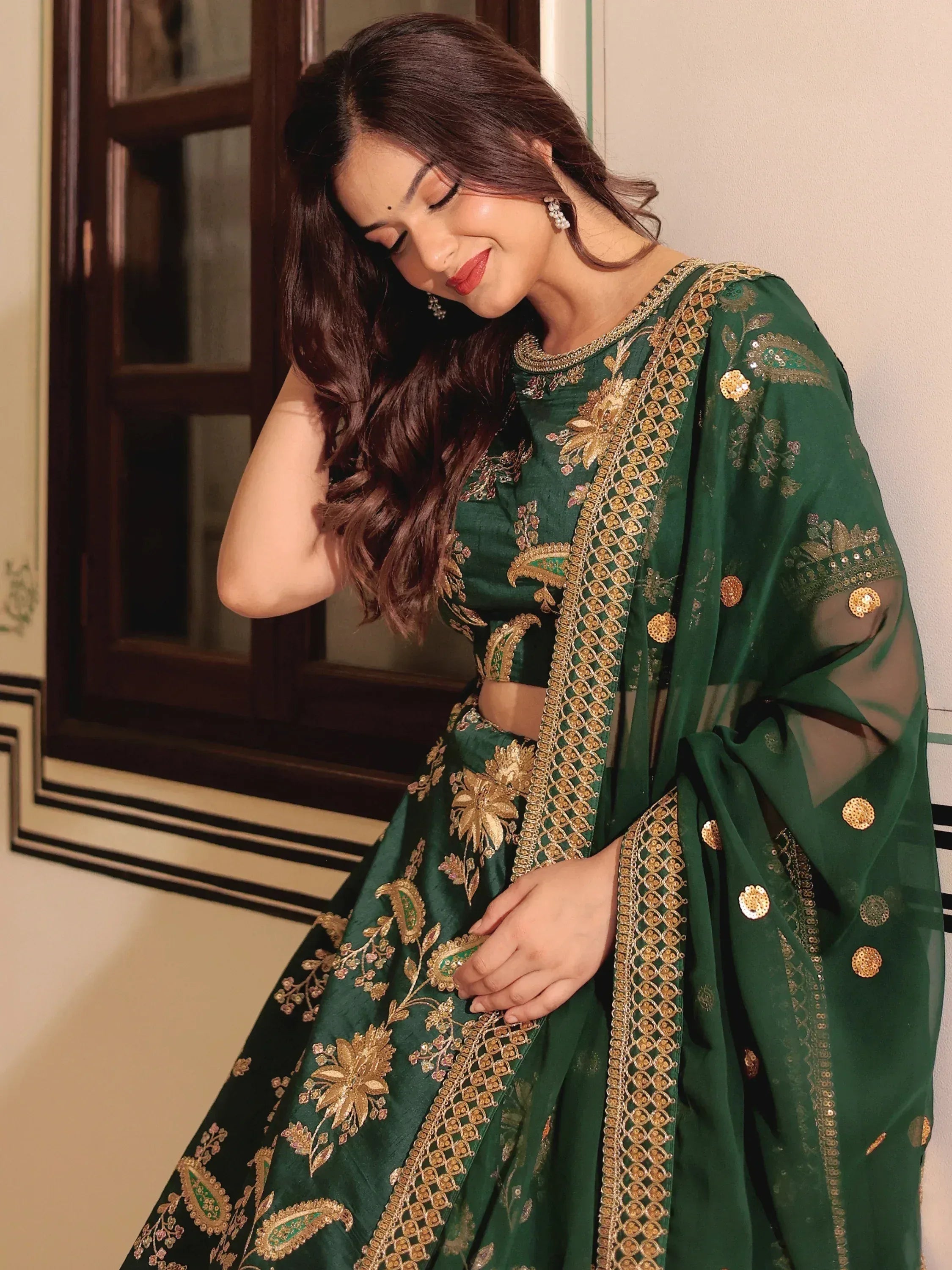 Emerald green designer lehenga choli with gold embroidery and sheer dupatta for Indian ethnic wear