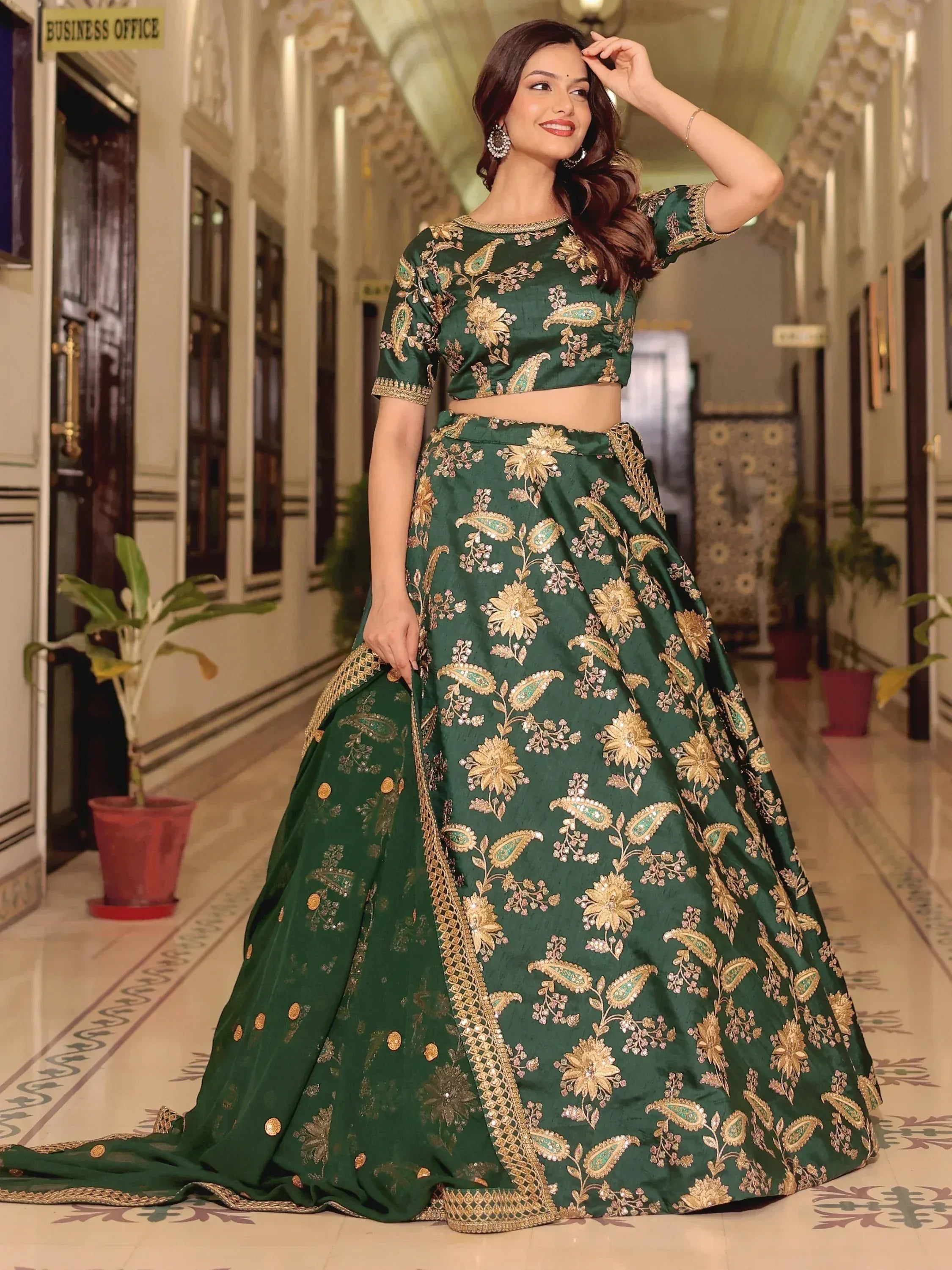 Emerald green designer lehenga choli with gold floral embroidery, perfect for Indian ethnic occasions
