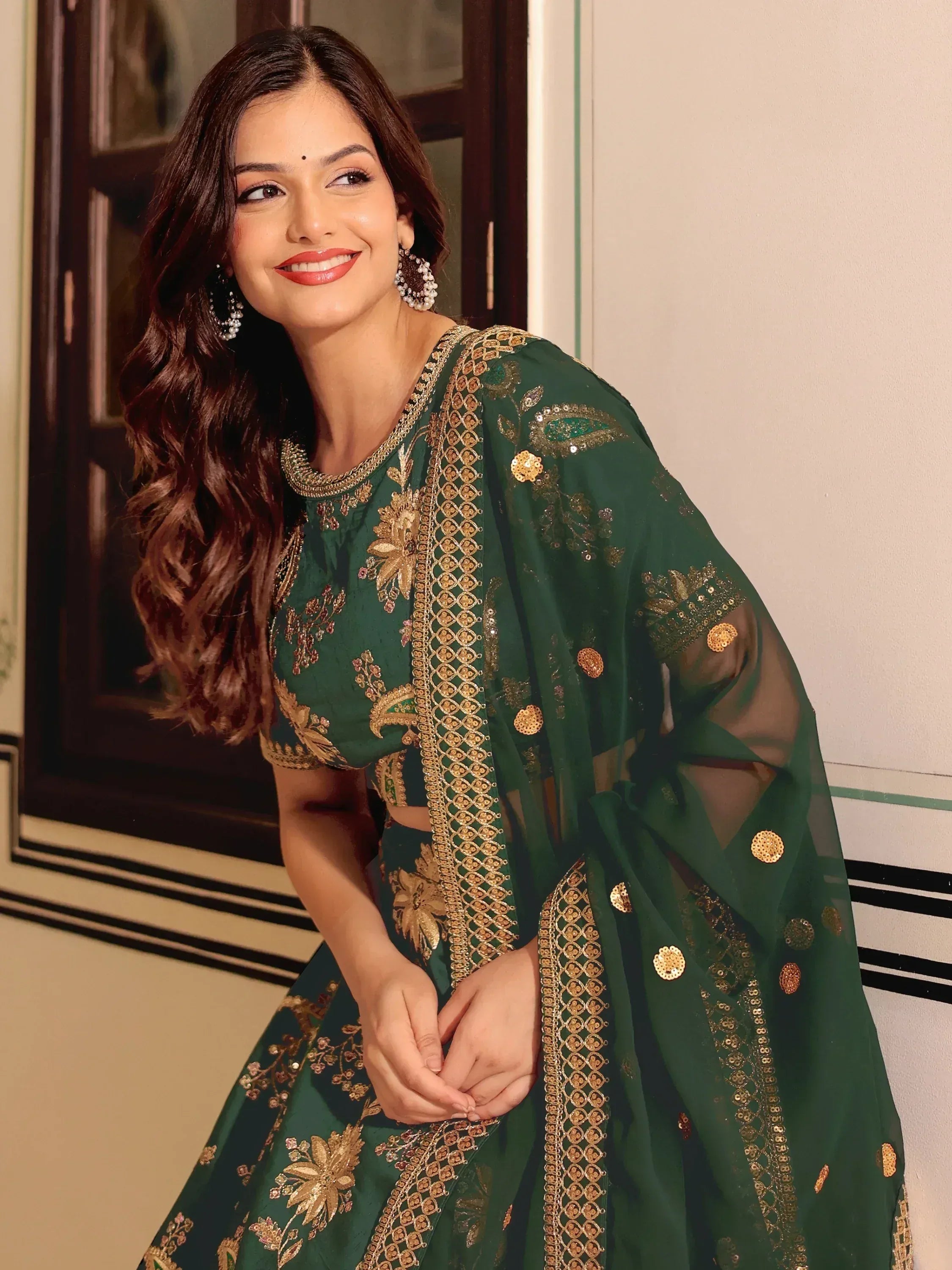 Green embroidered lehenga choli with gold detailing, perfect for Indian ethnic wear occasions