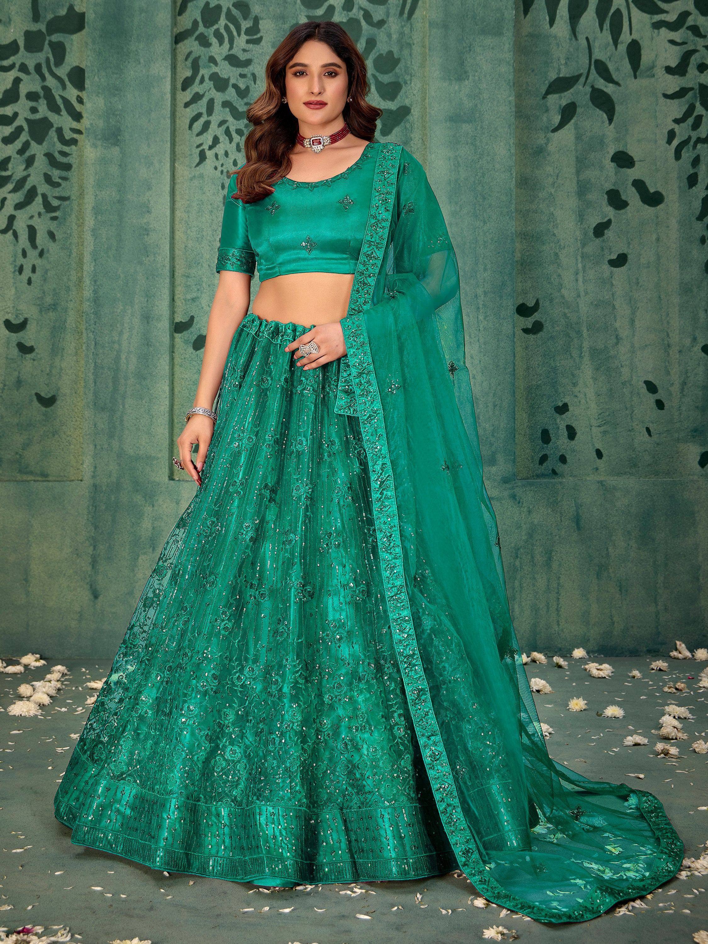 Emerald green designer lehenga choli with sequin embroidery and sheer dupatta, perfect for Indian ethnic occasions.