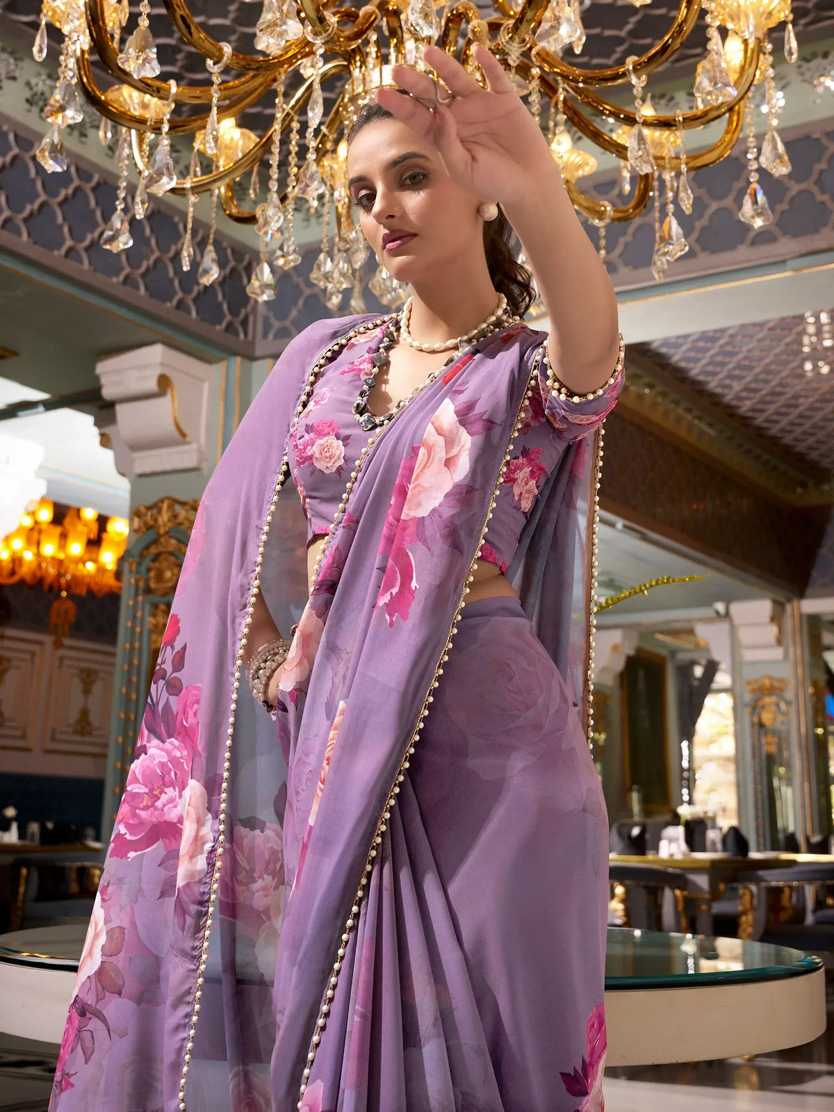 Purple floral saree with pearl border, elegant Indian ethnic wear for special occasions