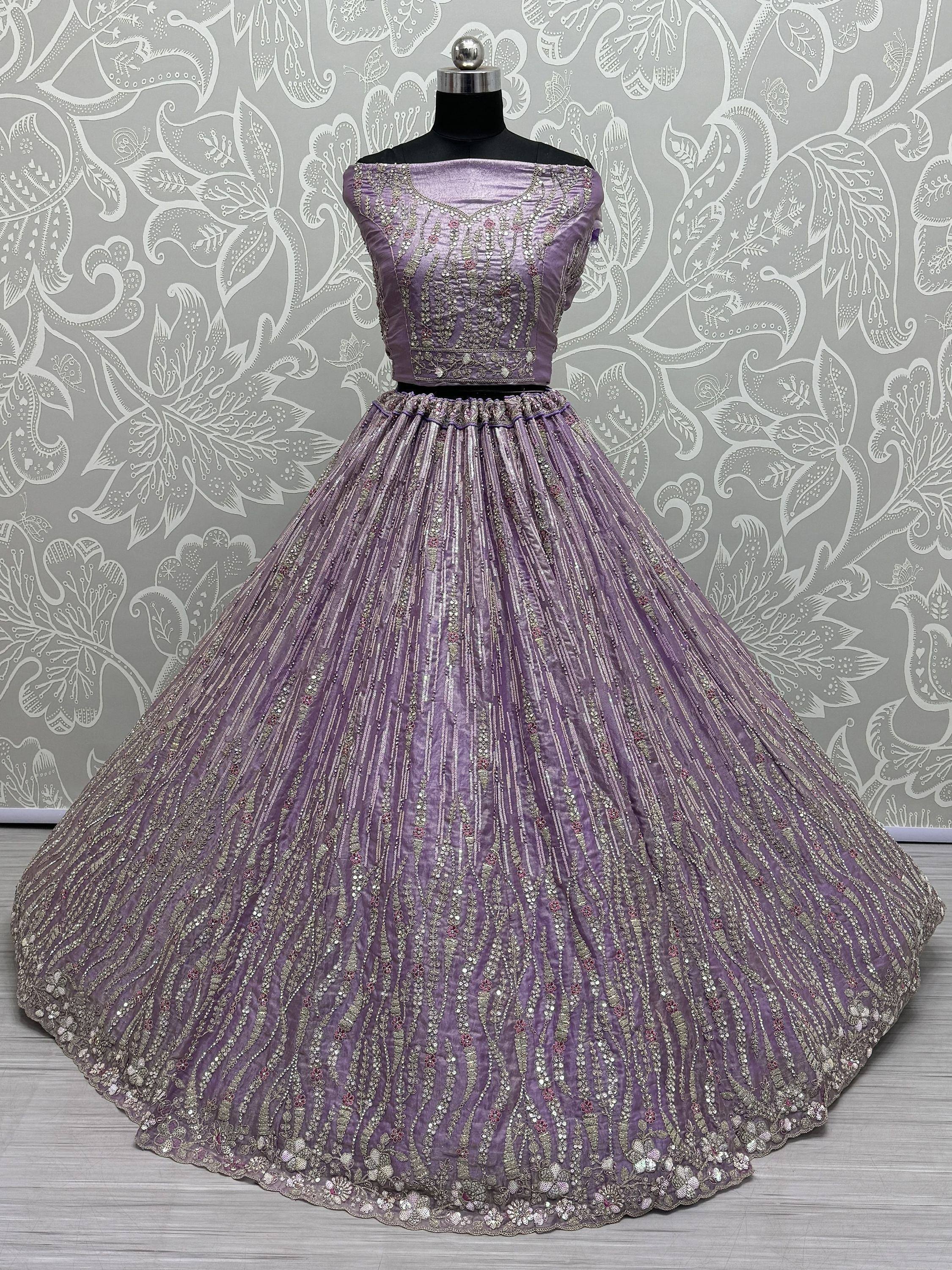 Lavender designer lehenga choli with intricate embroidery and sequins, perfect for Indian ethnic occasions.